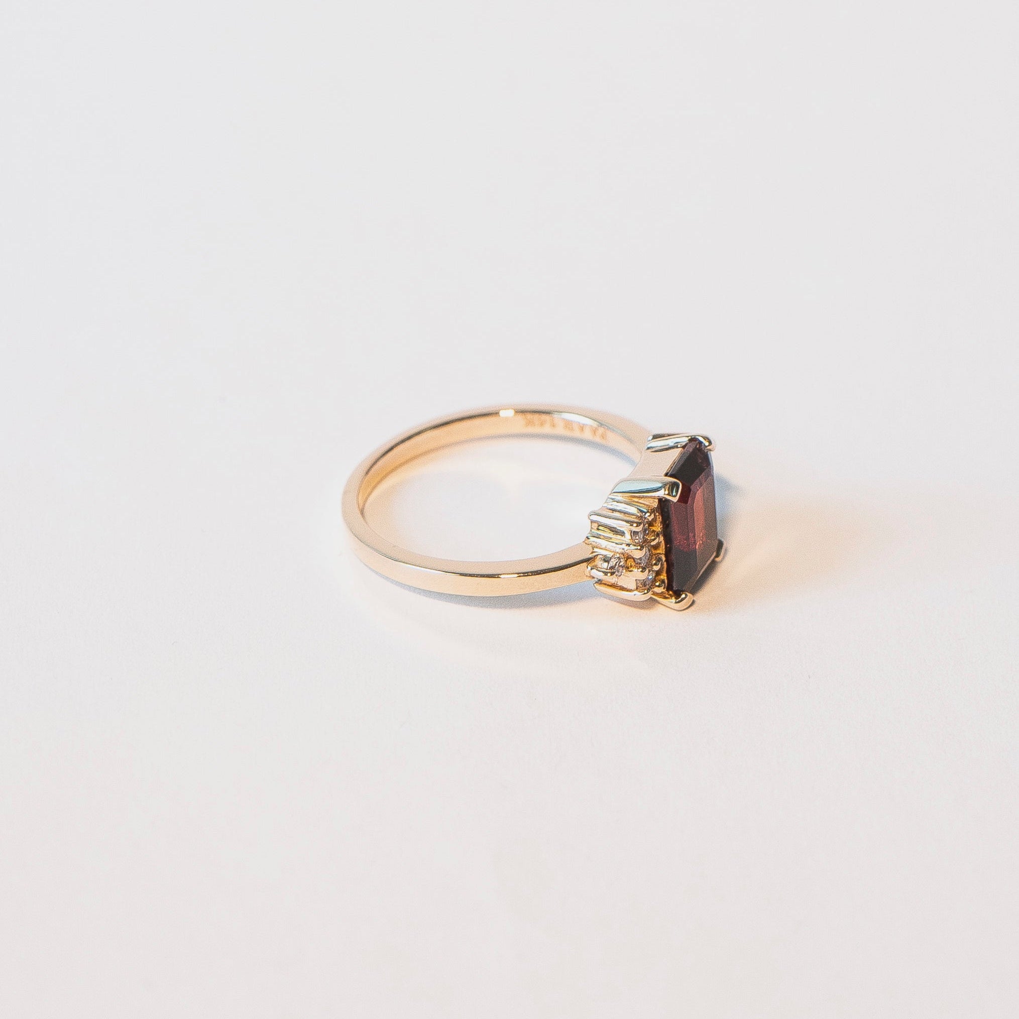Emerald-cut garnet ring with eight diamonds