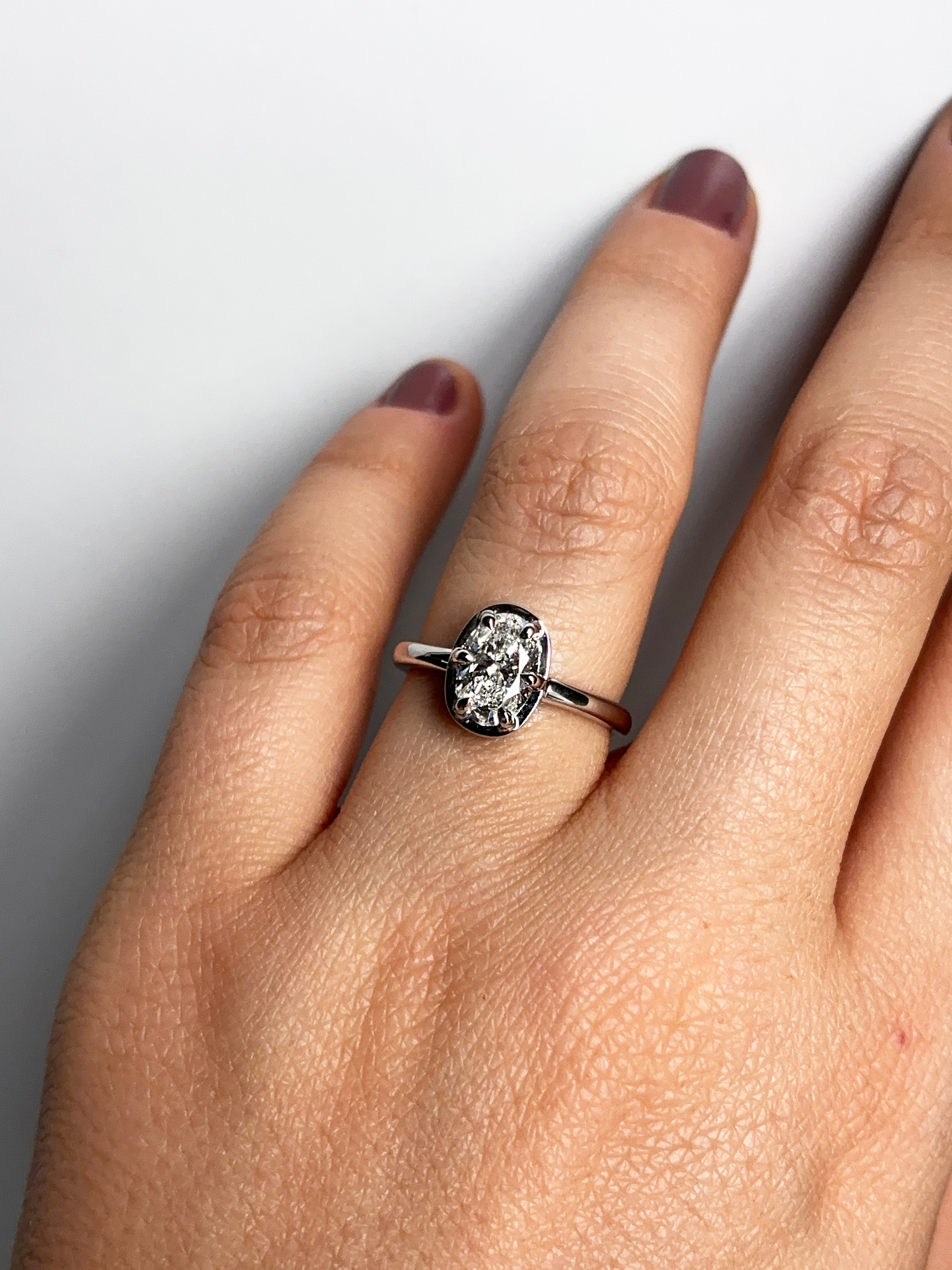 14k white gold oval lab-grown diamond ring with six-prong half-bezel