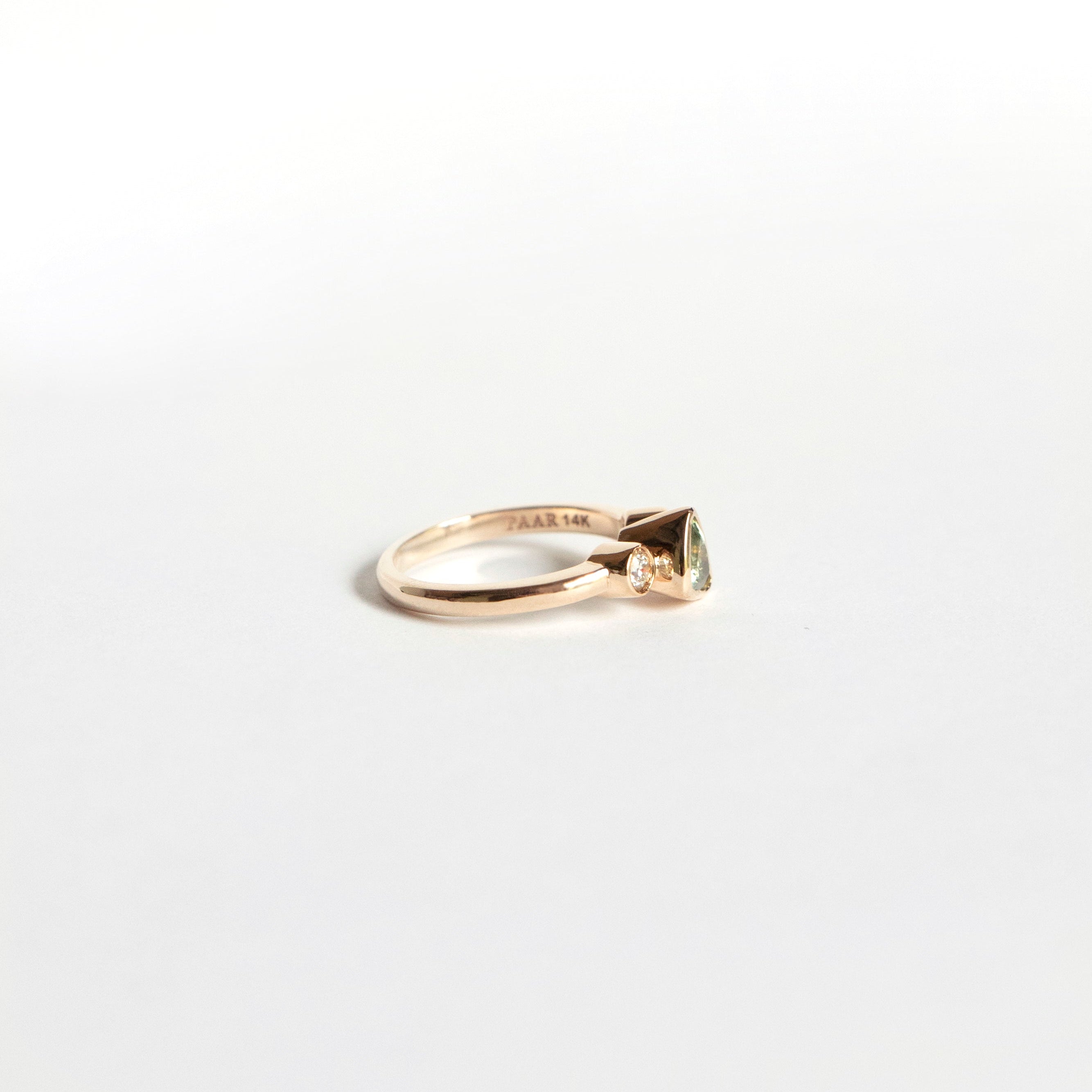 Trillion-cut natural sapphire bezel ring with two white diamonds