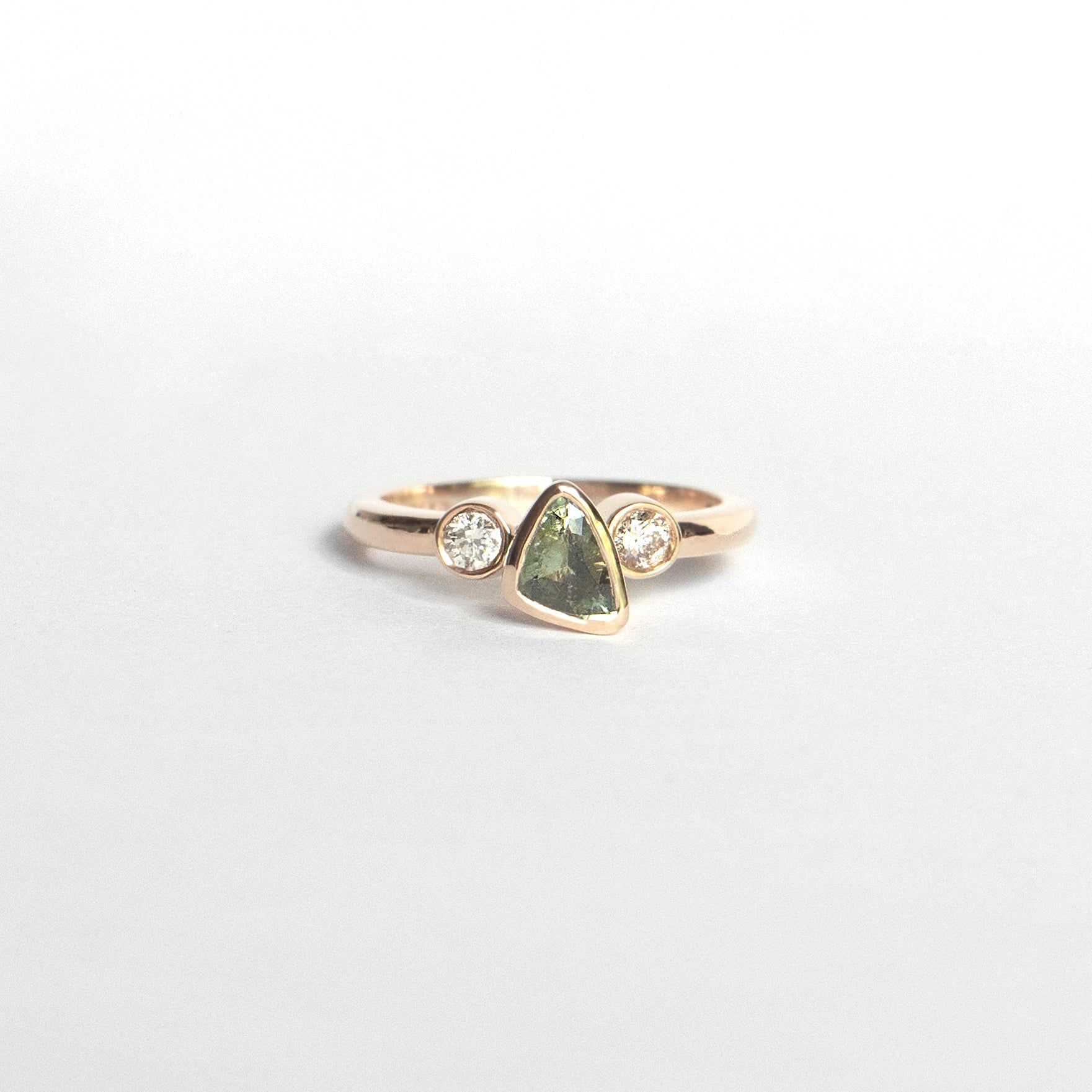 Trillion-cut natural sapphire bezel ring with two white diamonds