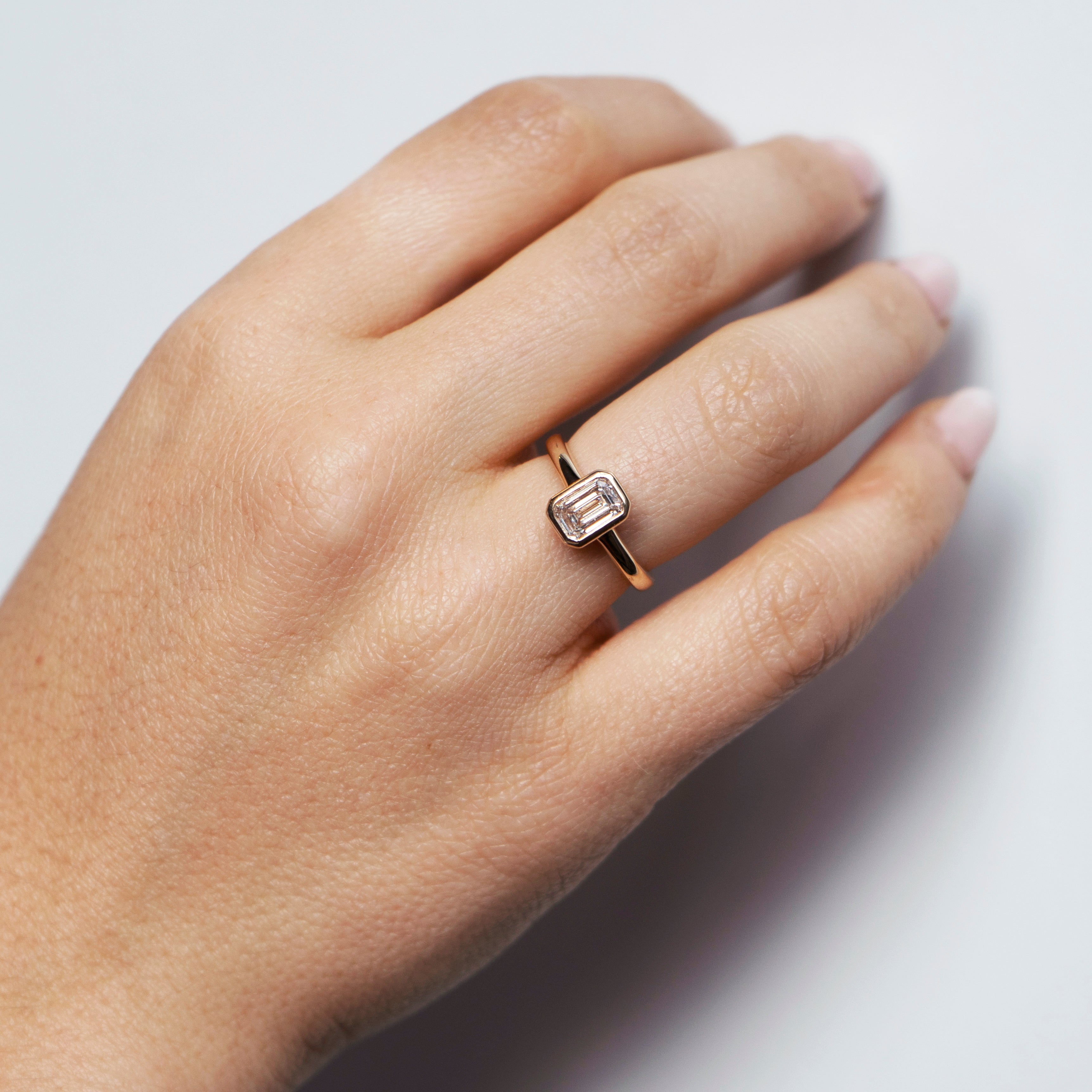 Emerald-cut lab-grown diamond engagement ring and diamond wedding band set