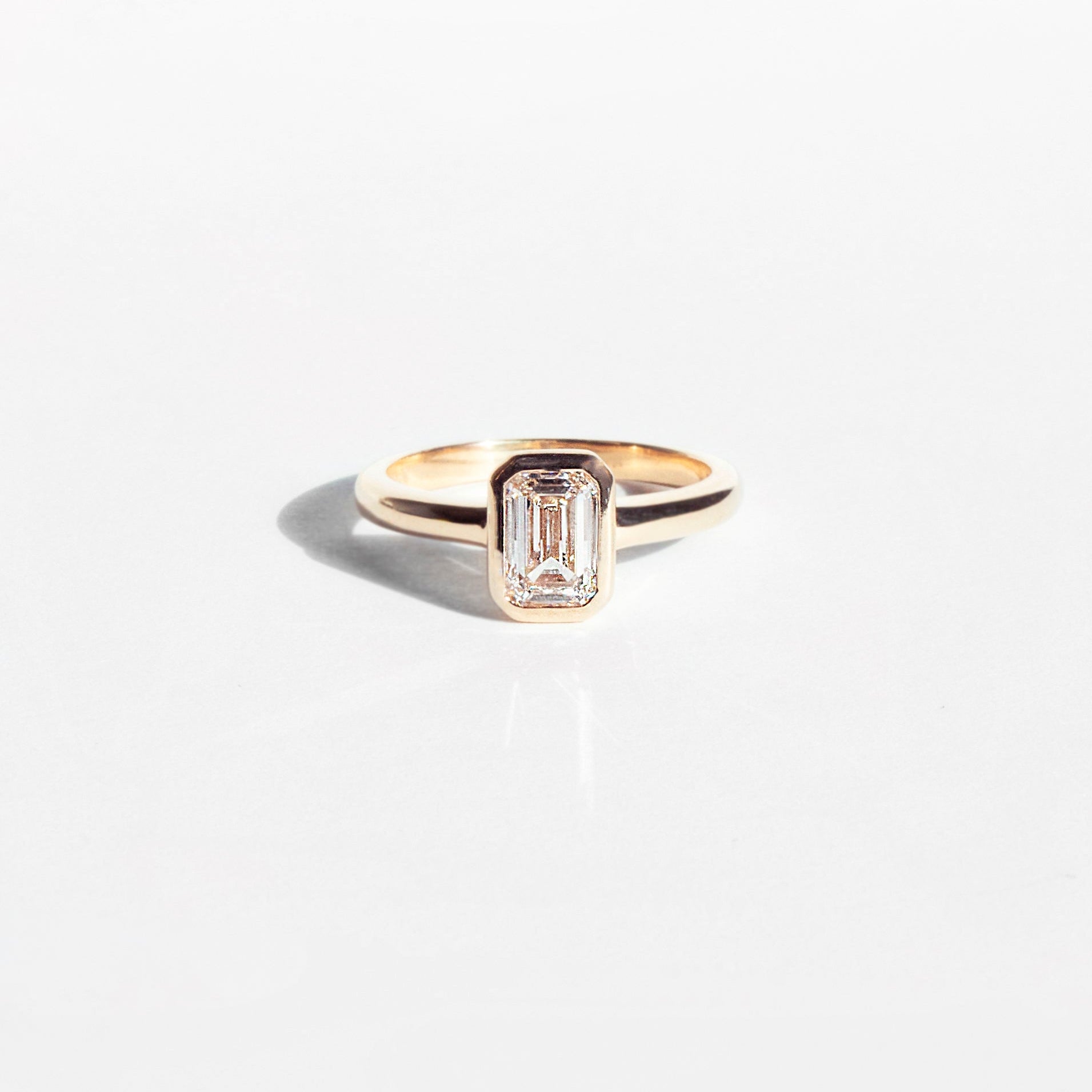 Emerald-cut lab-grown diamond engagement ring and diamond wedding band set