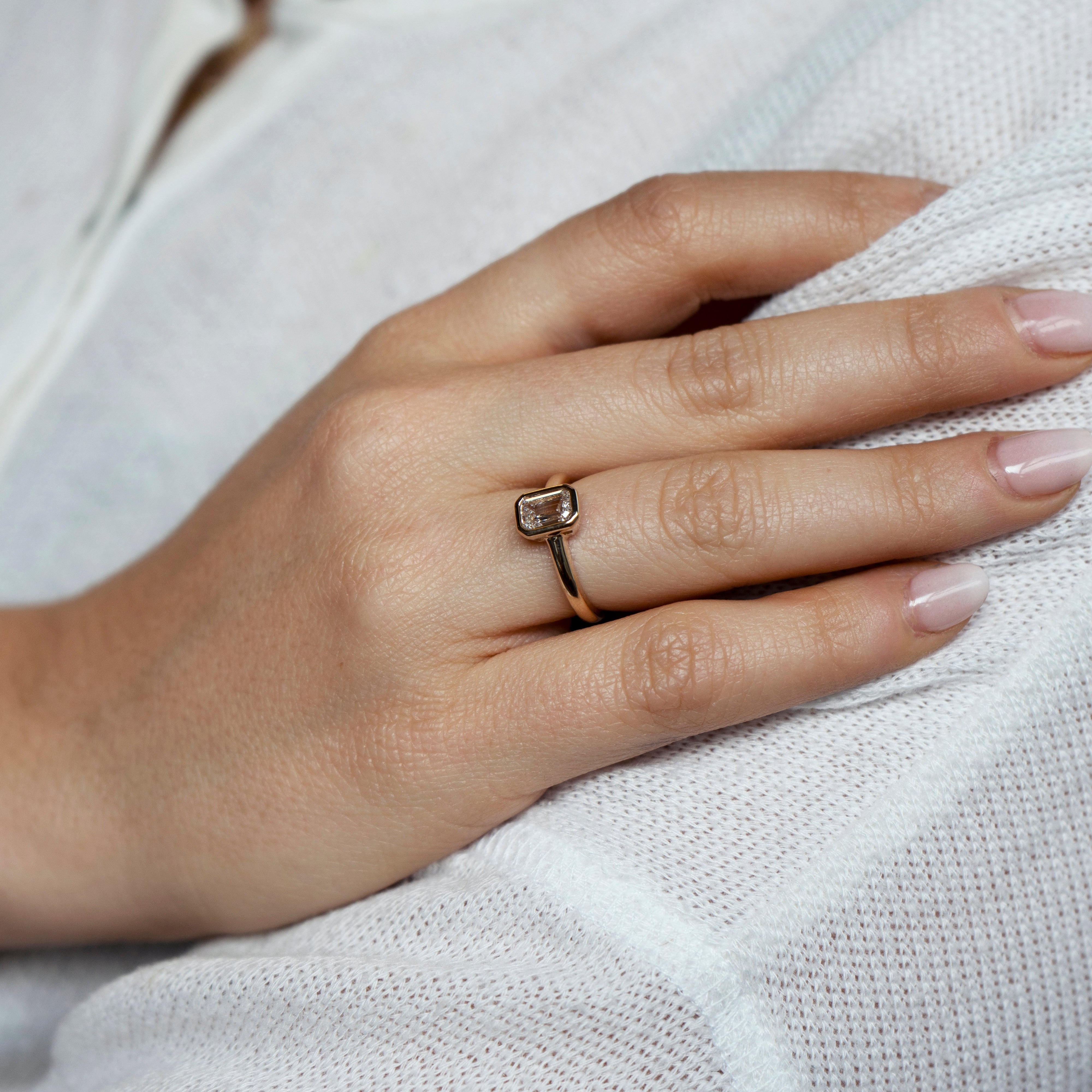 Emerald-cut lab-grown diamond engagement ring and diamond wedding band set