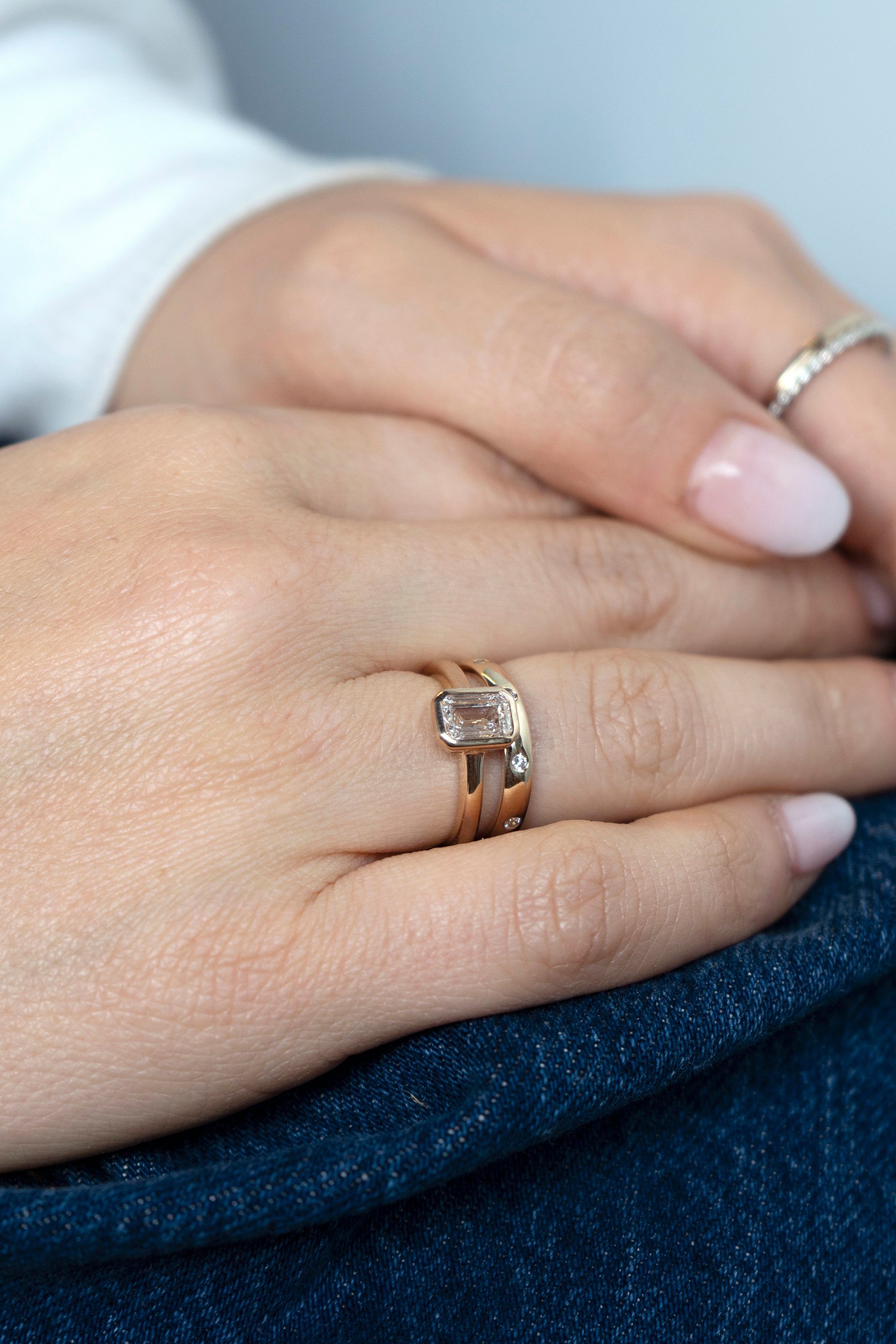 Emerald-cut lab-grown diamond engagement ring and diamond wedding band set