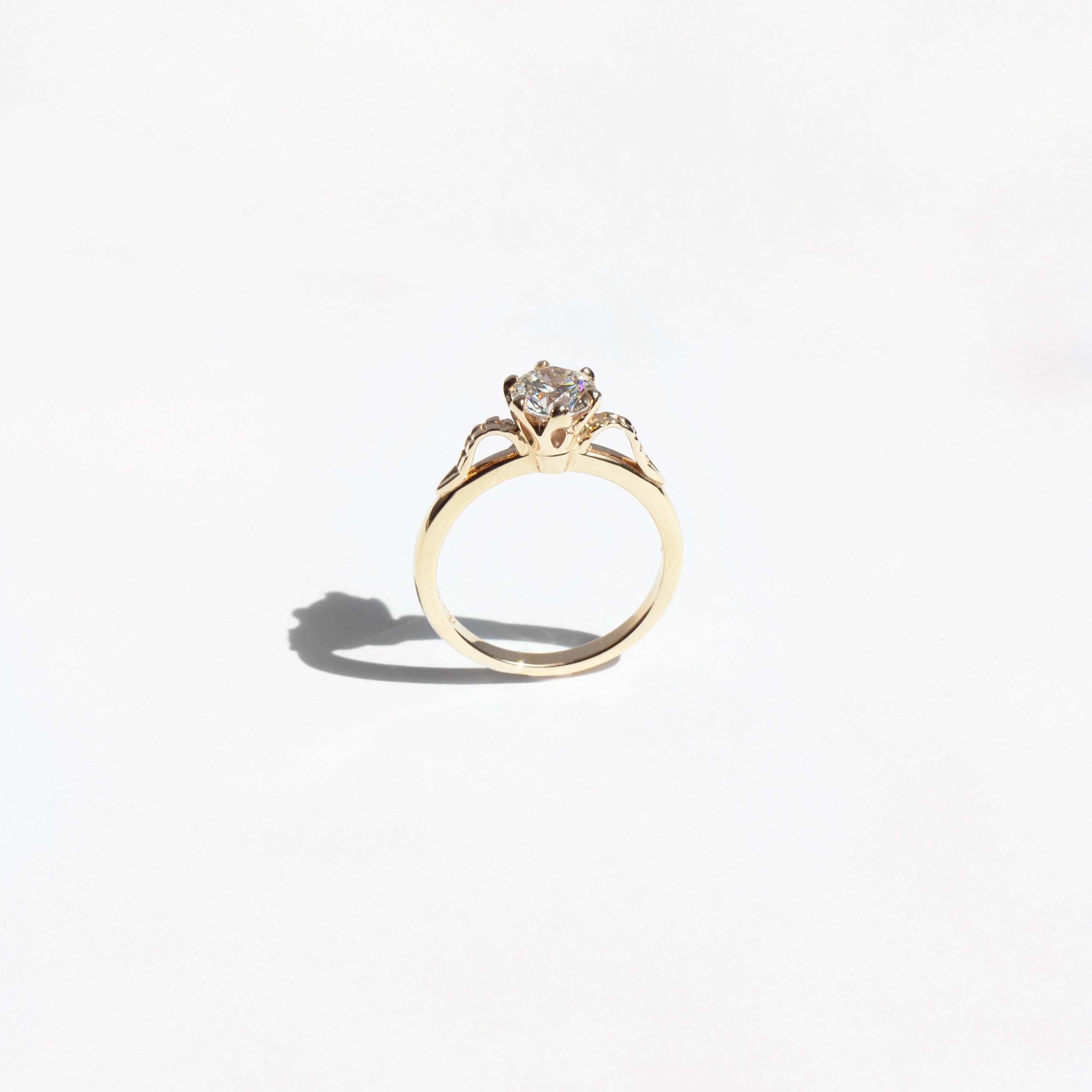 Floral six-prong round diamond ring in 14k yellow gold