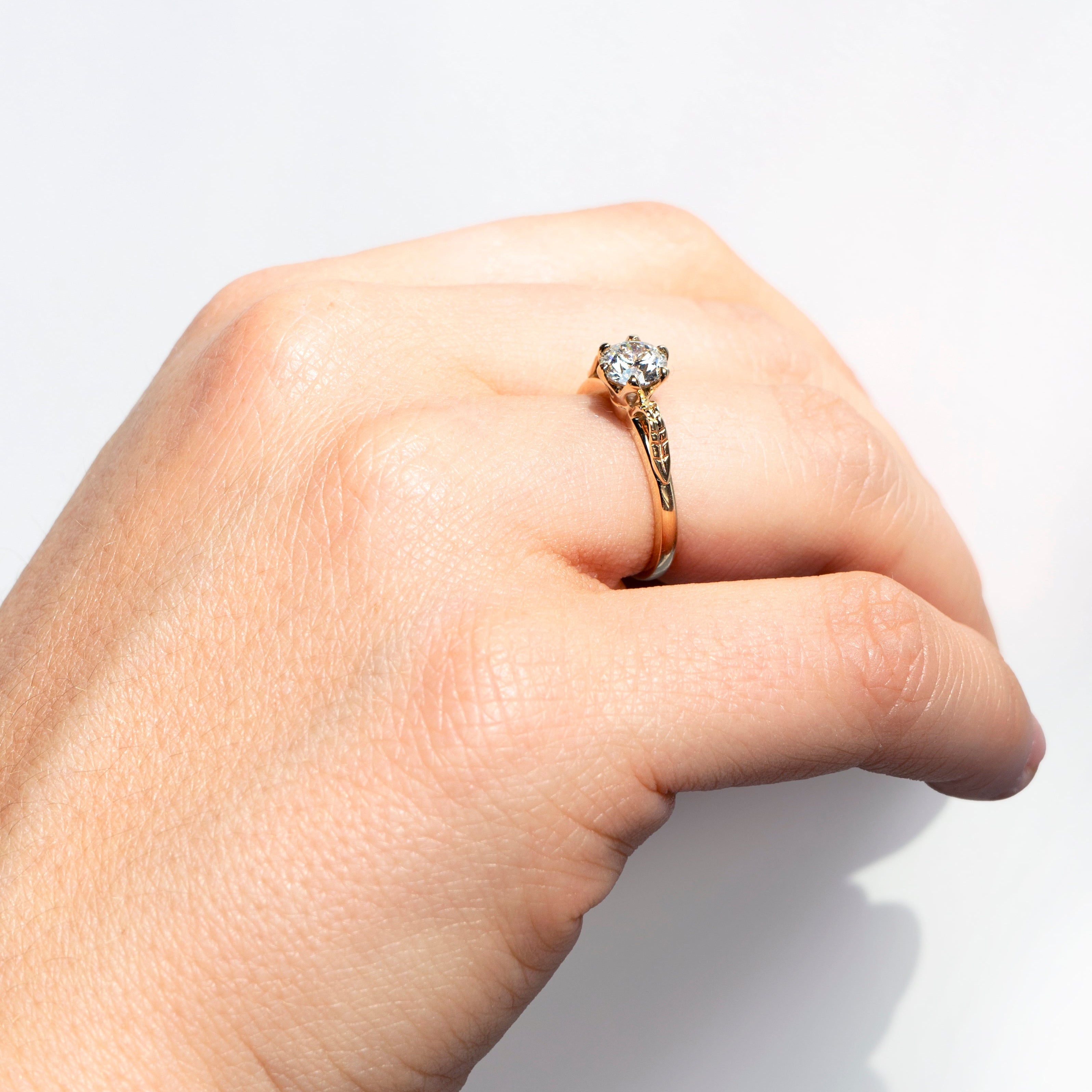 Floral six-prong round diamond ring in 14k yellow gold