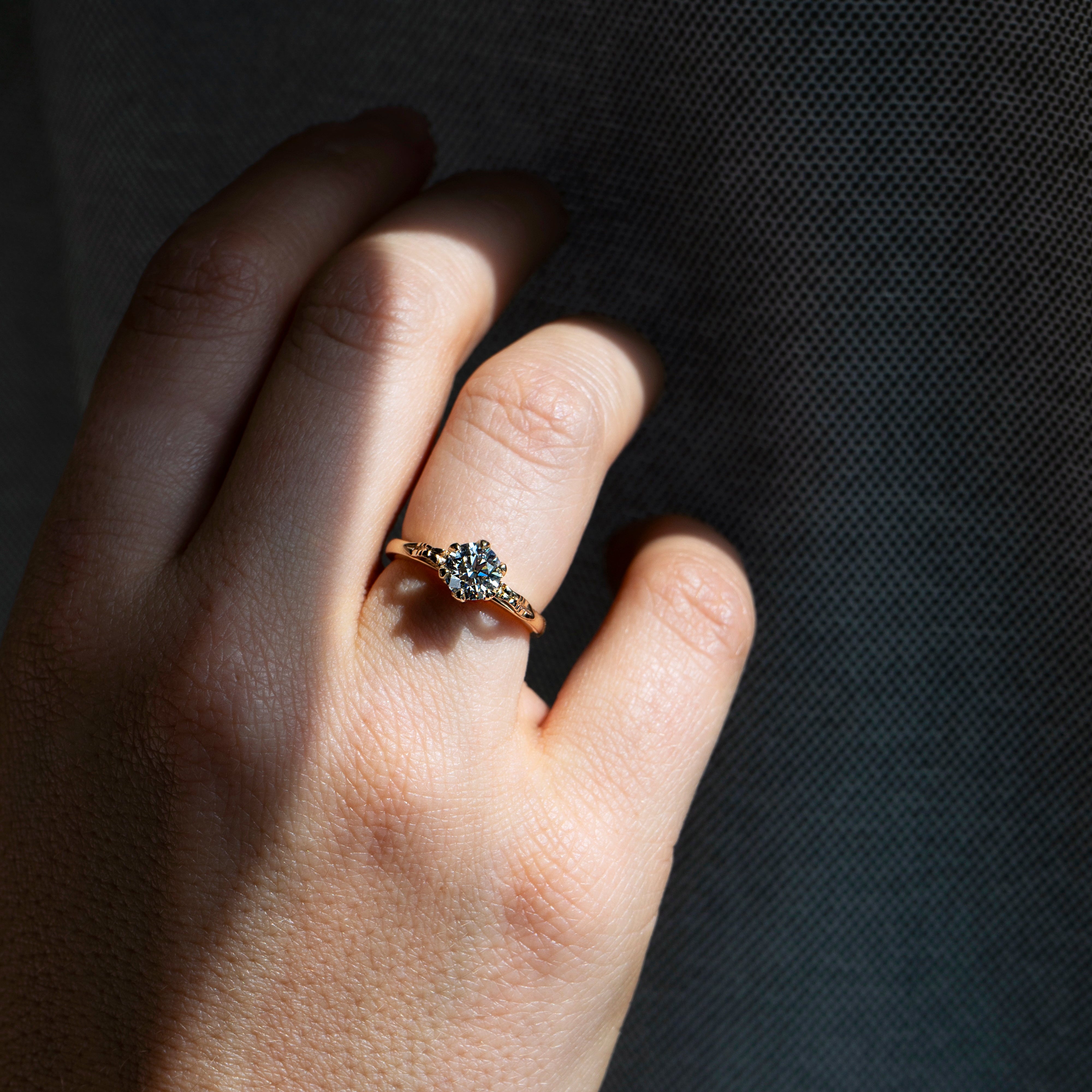 Floral six-prong round diamond ring in 14k yellow gold