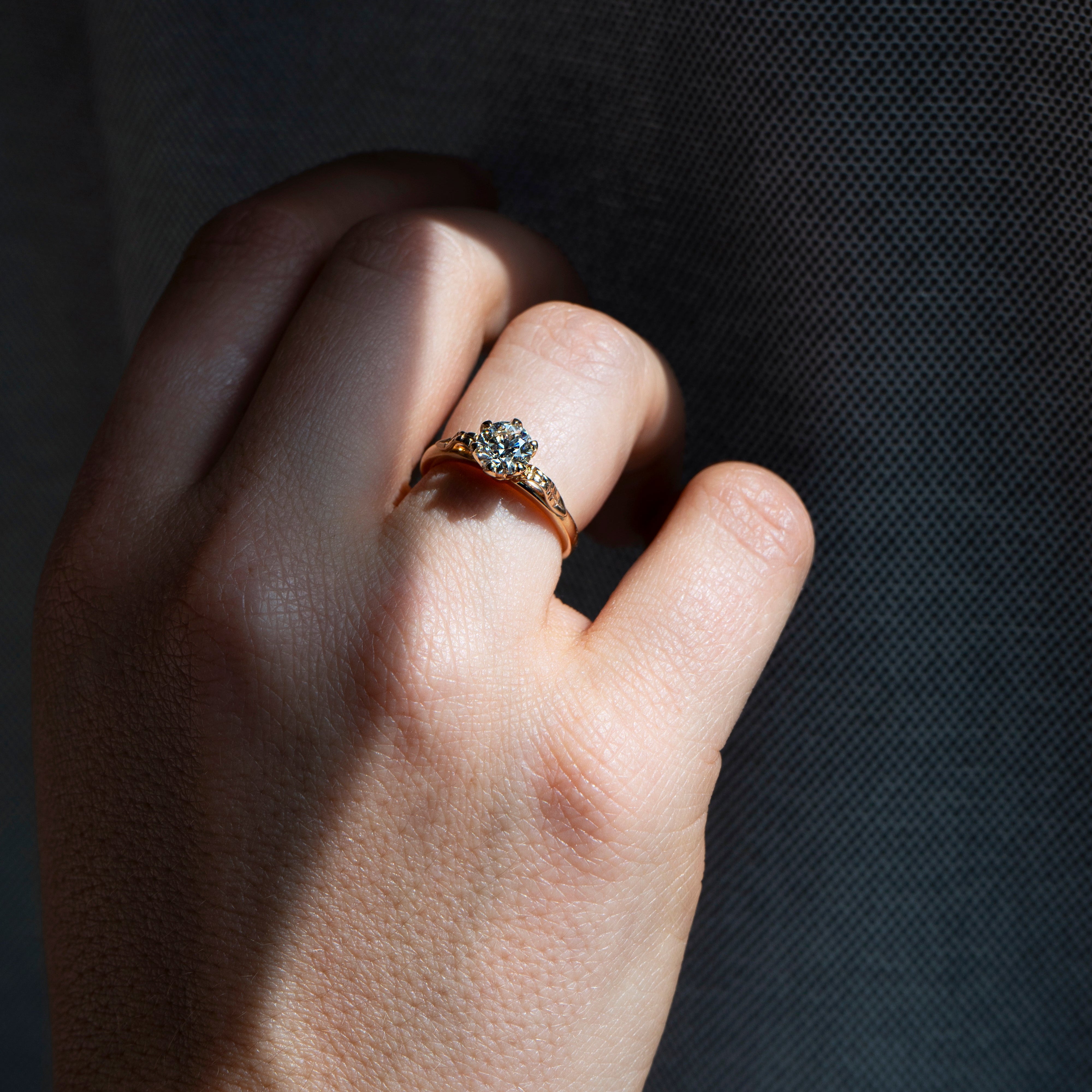 Floral six-prong round diamond ring in 14k yellow gold