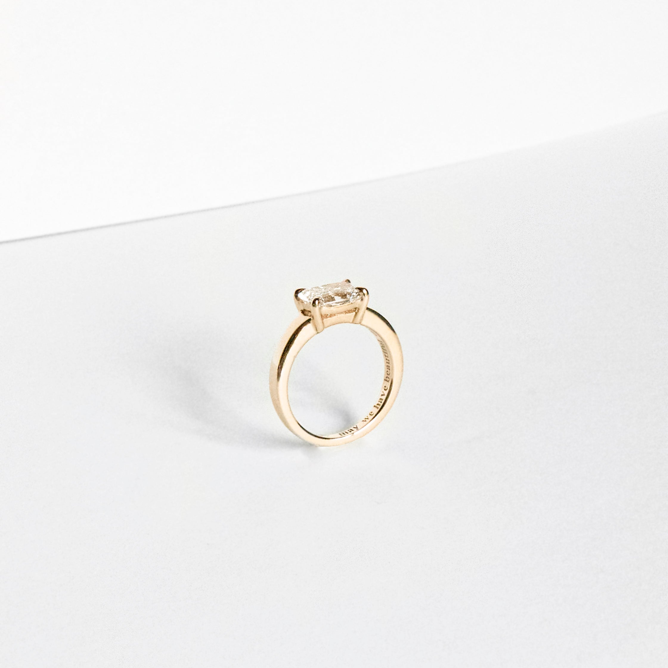 Radiant-cut lab-grown diamond engagement ring set east-west