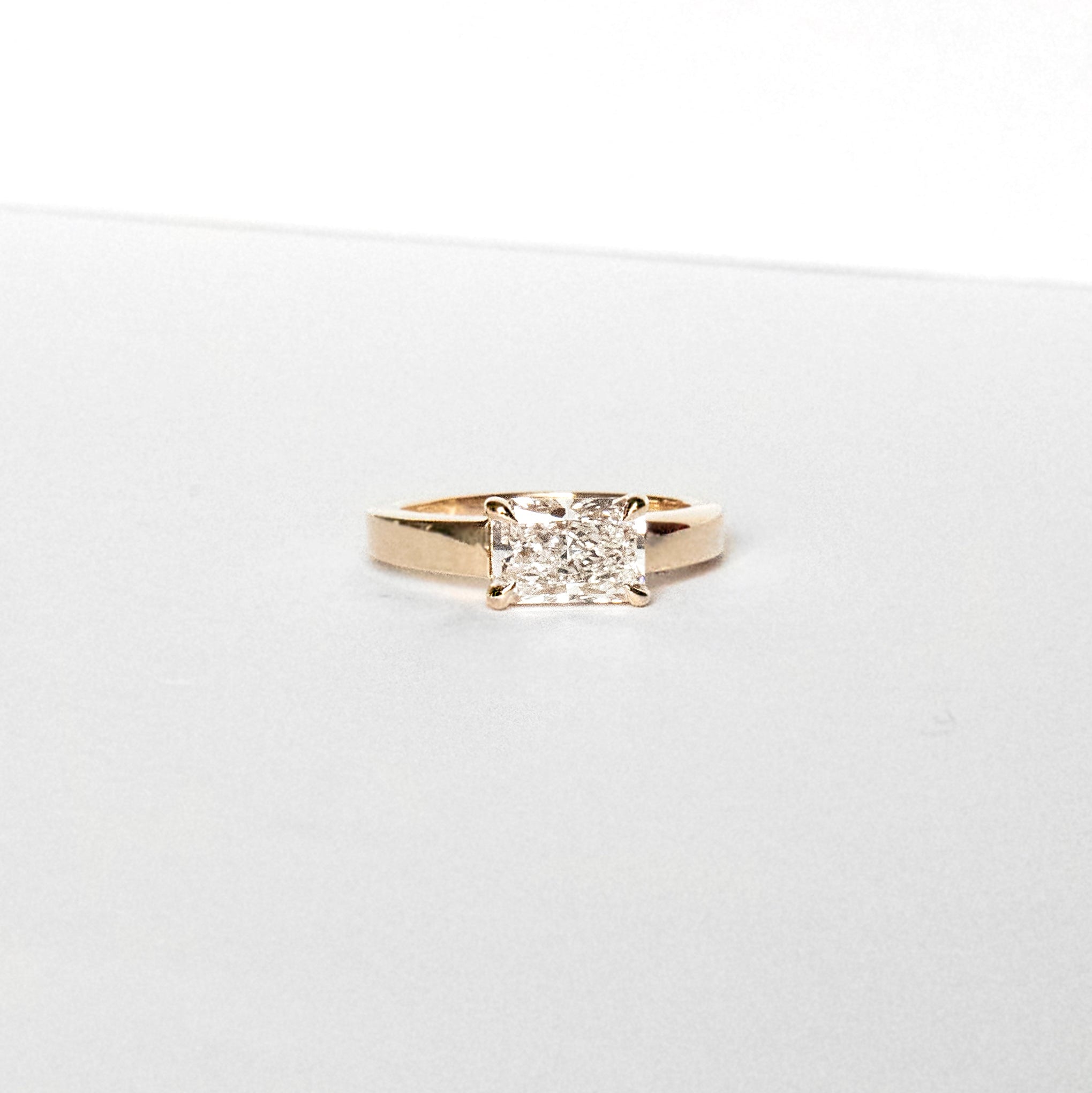 Radiant-cut lab-grown diamond engagement ring set east-west