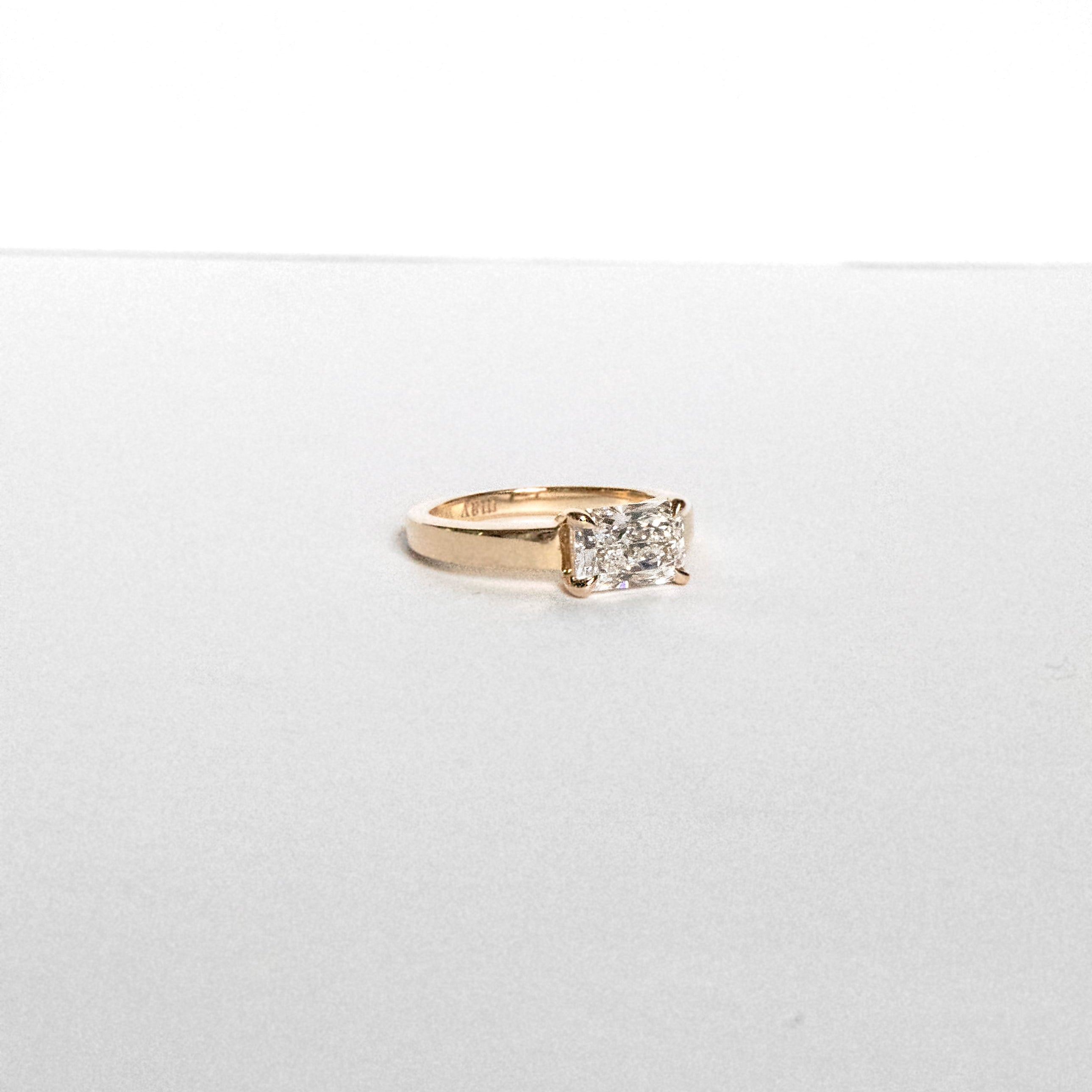 Radiant-cut lab-grown diamond engagement ring set east-west