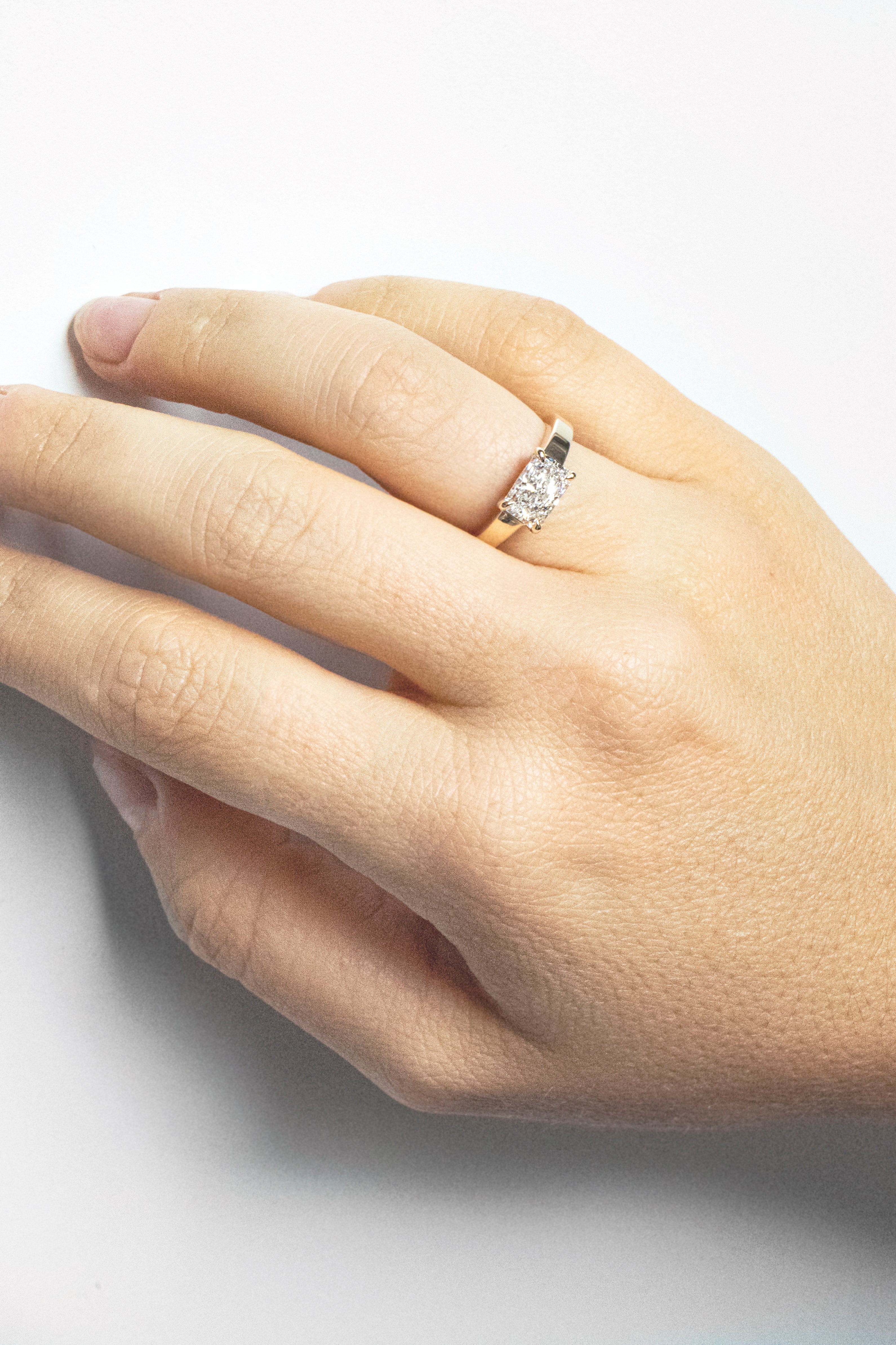Radiant-cut lab-grown diamond engagement ring set east-west