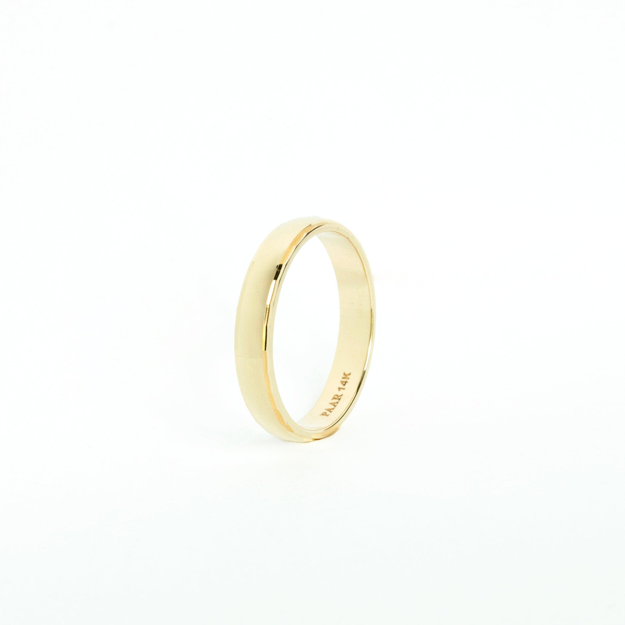 Yellow gold half-round wedding band with faceted edges and comfort-fit