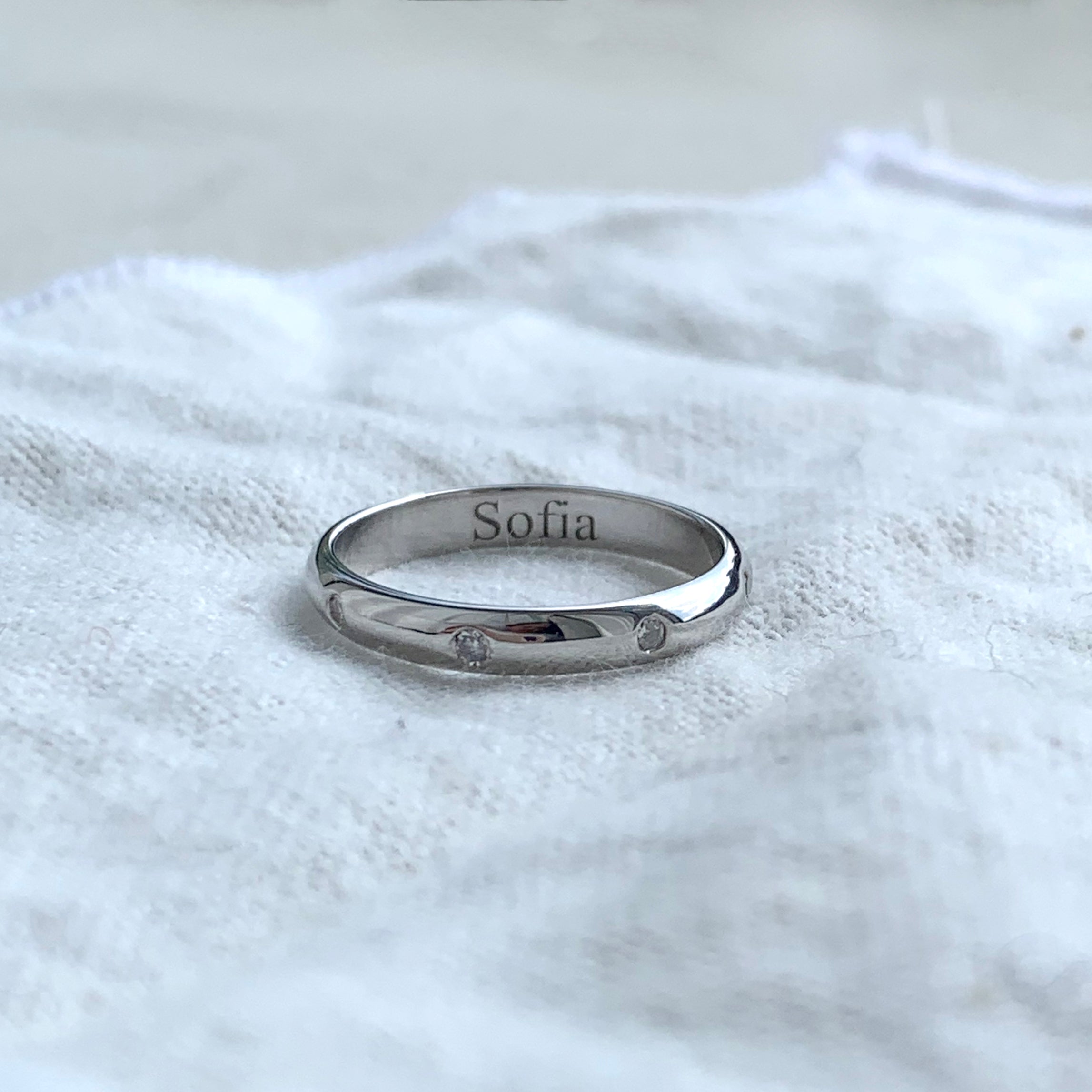 White Gold Wedding Band with Embedded Diamonds