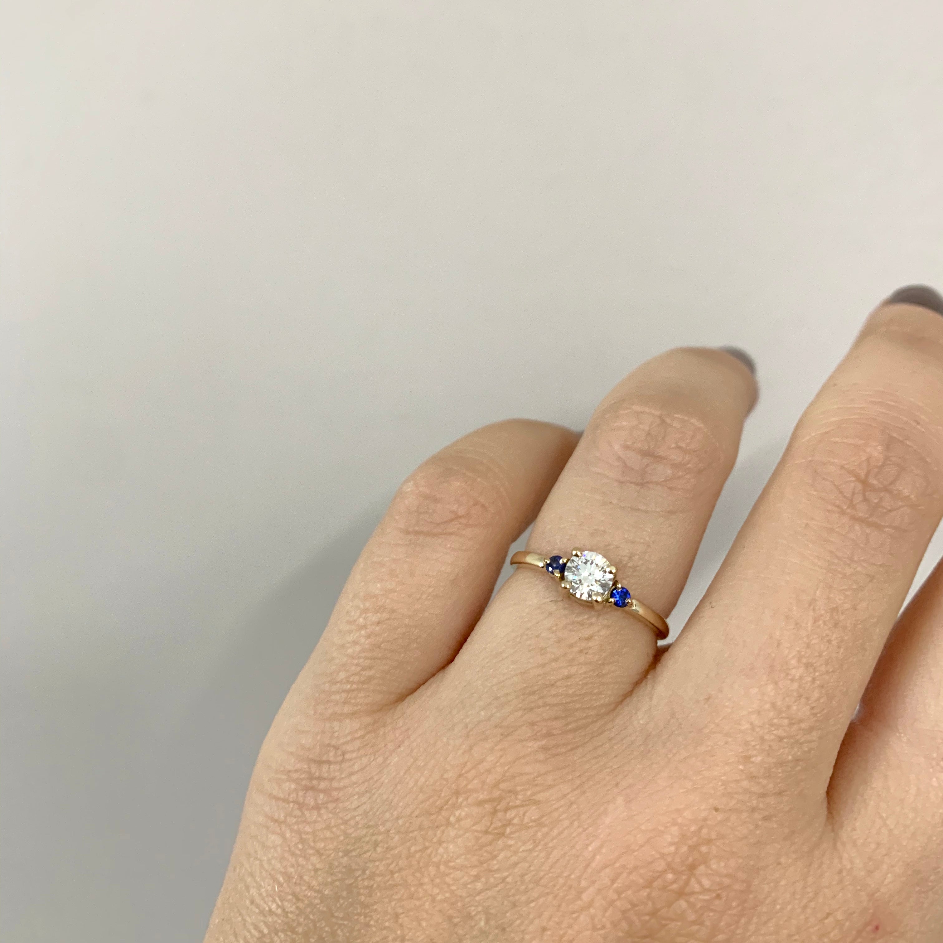 White diamond and blue sapphires engagement ring
