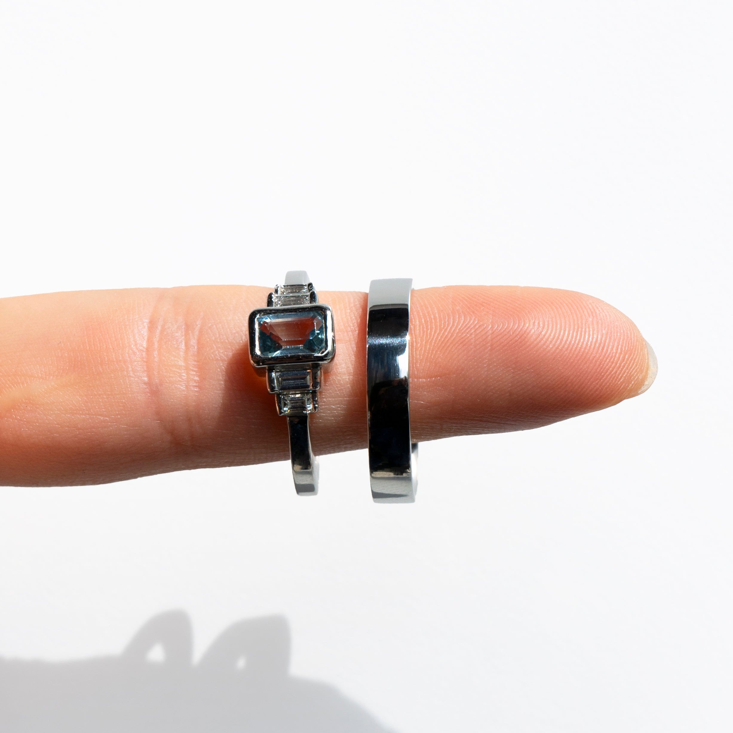 Emerald-cut aquamarine and baguette diamonds platinum engagement ring