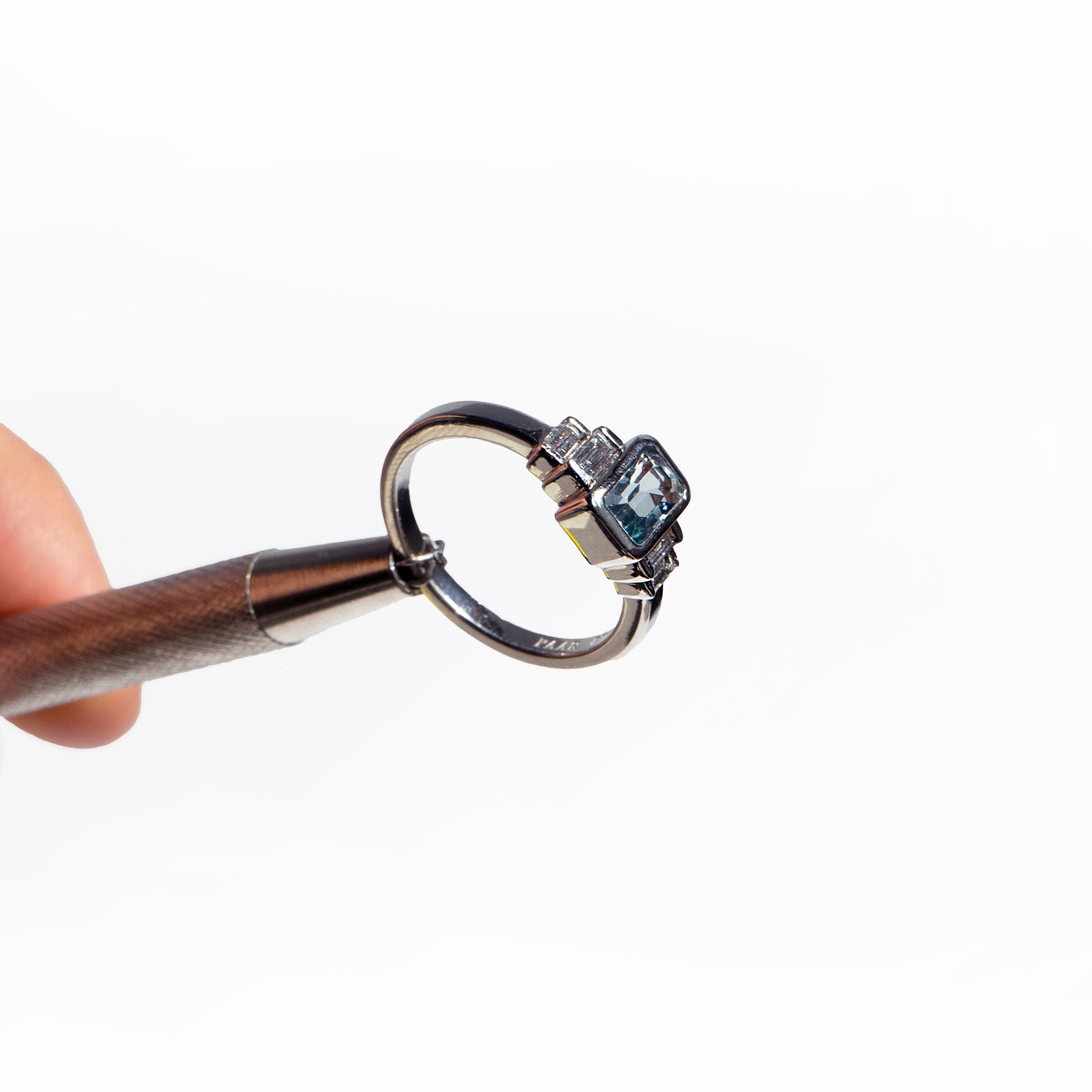 Emerald-cut aquamarine and baguette diamonds platinum engagement ring