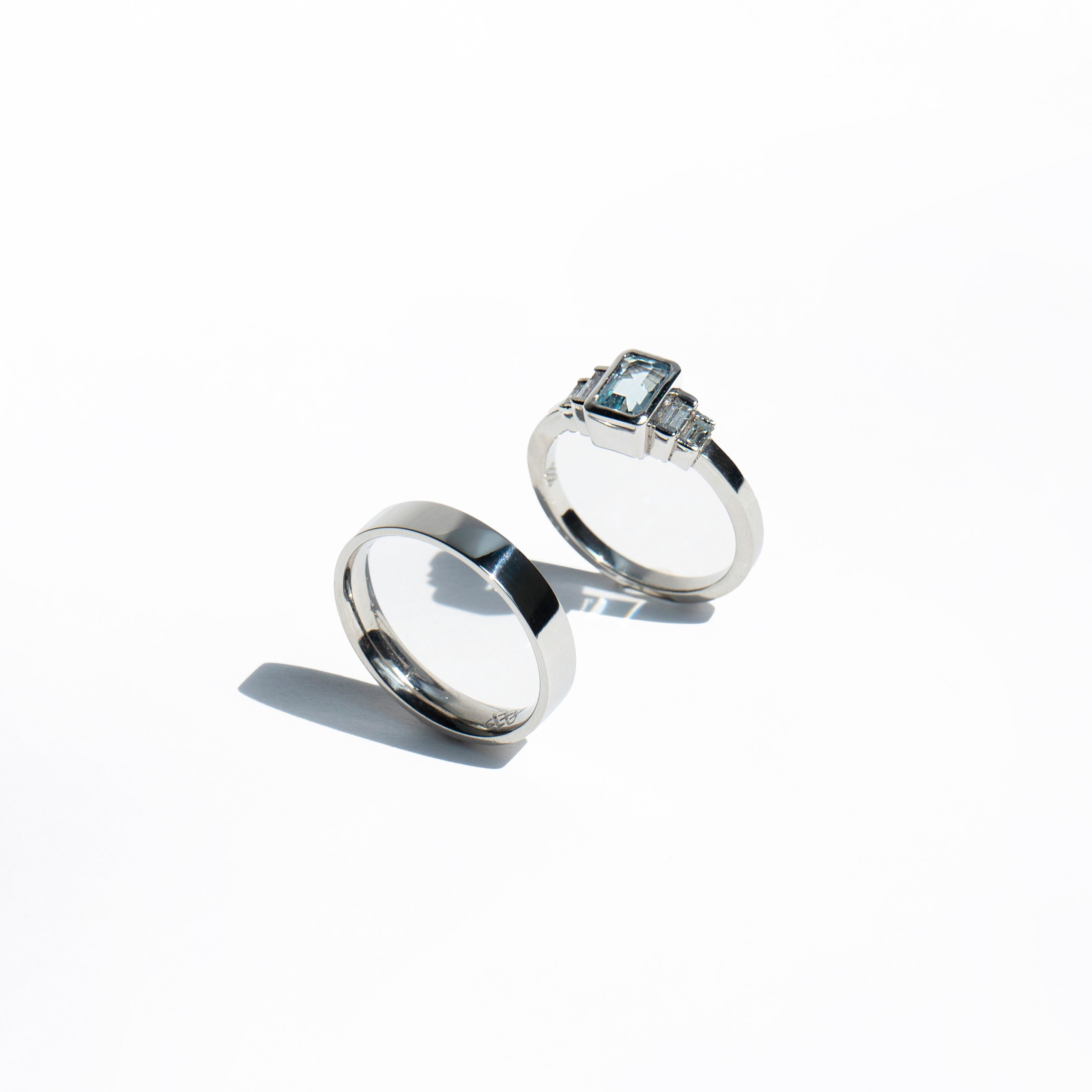 Emerald-cut aquamarine and baguette diamonds platinum engagement ring