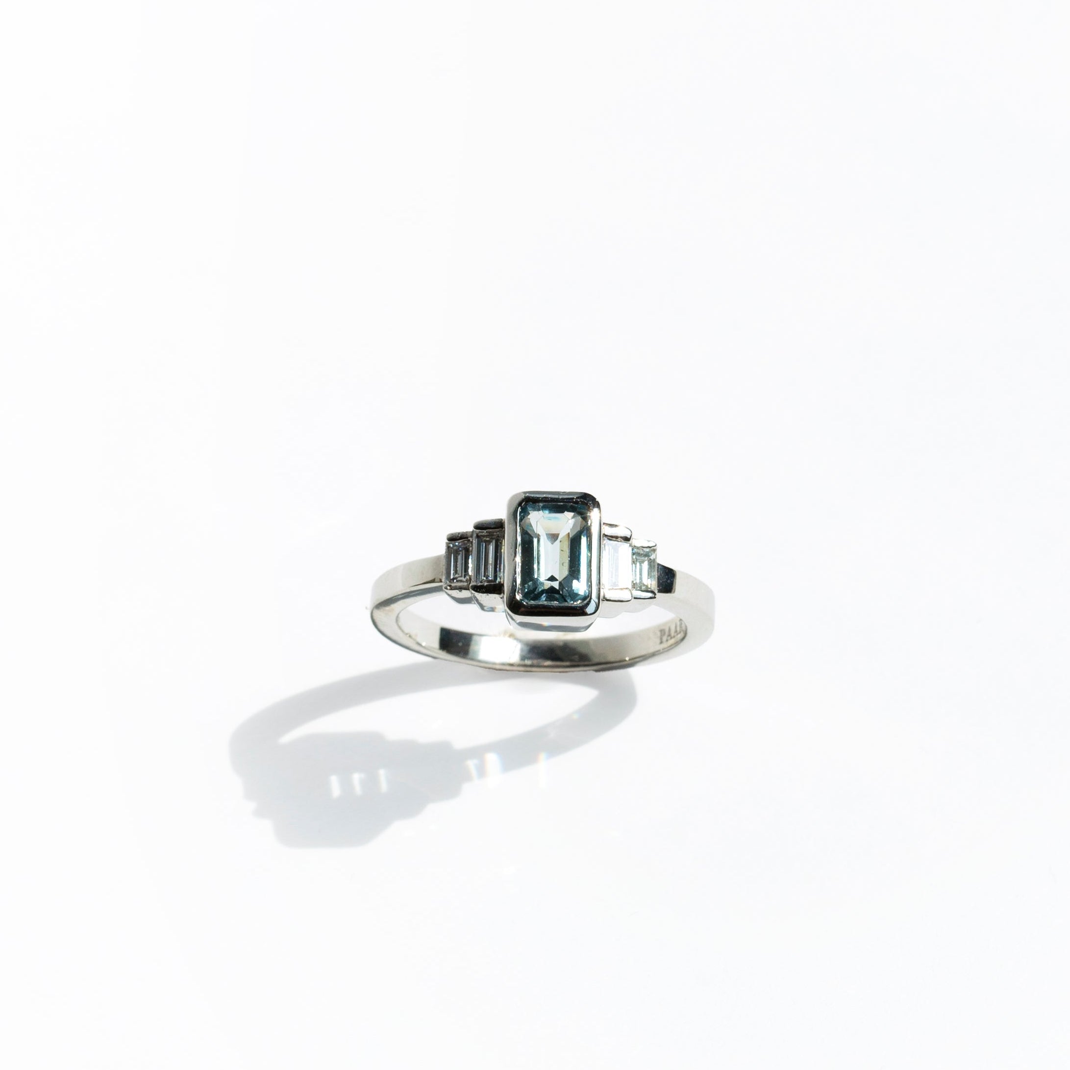 Emerald-cut aquamarine and baguette diamonds platinum engagement ring