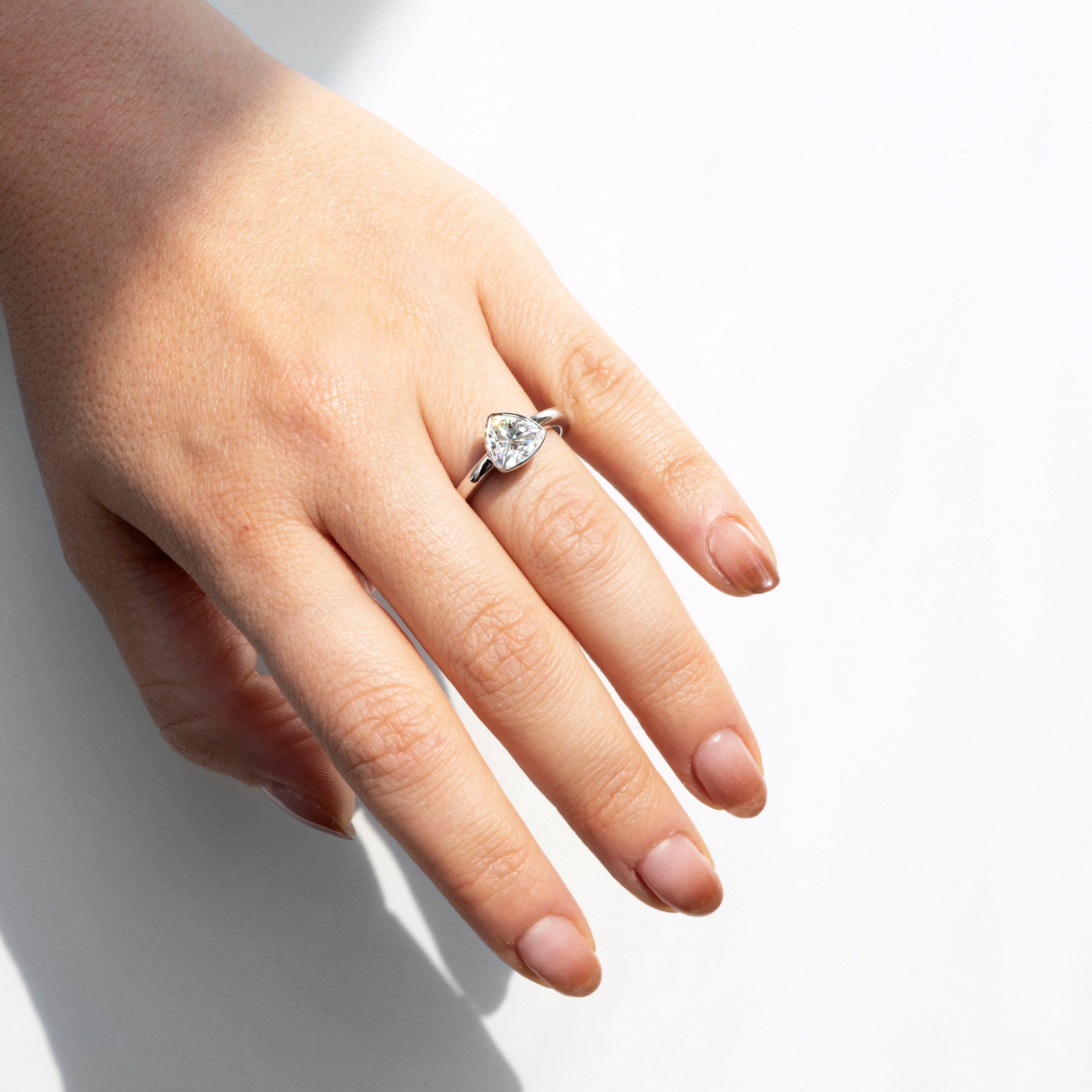 Trillion-cut moissanite bezel ring