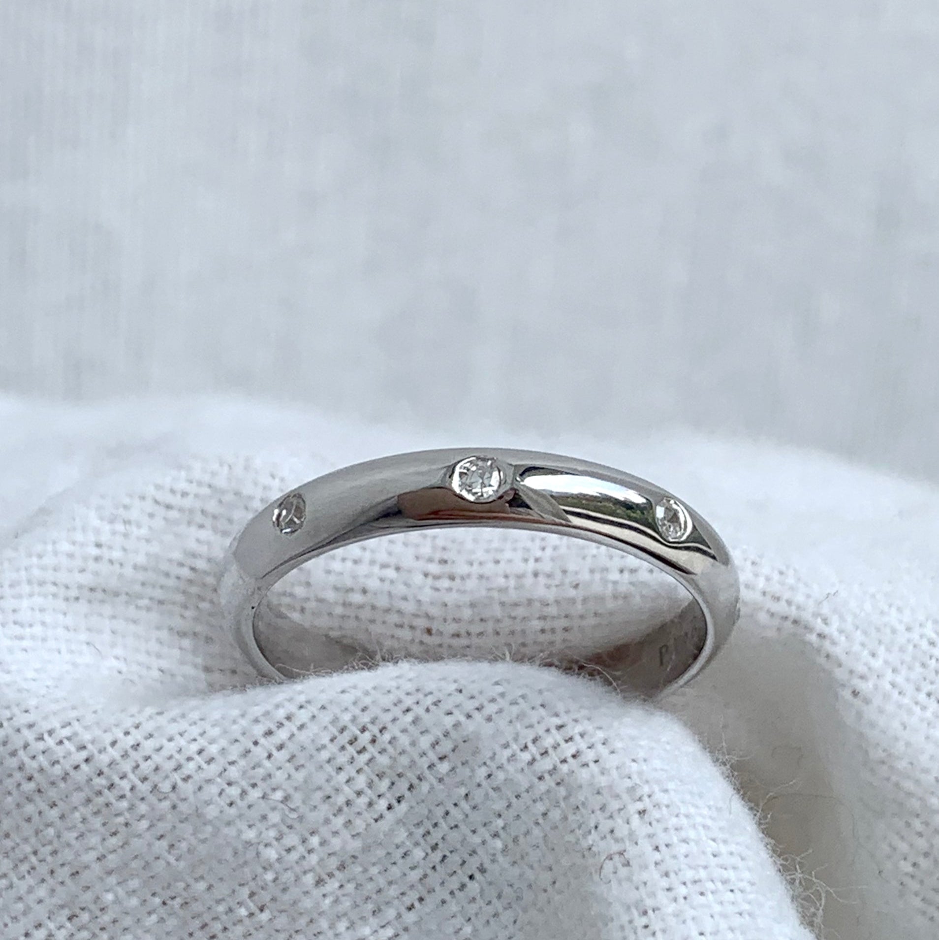 White Gold Wedding Band with Embedded Diamonds