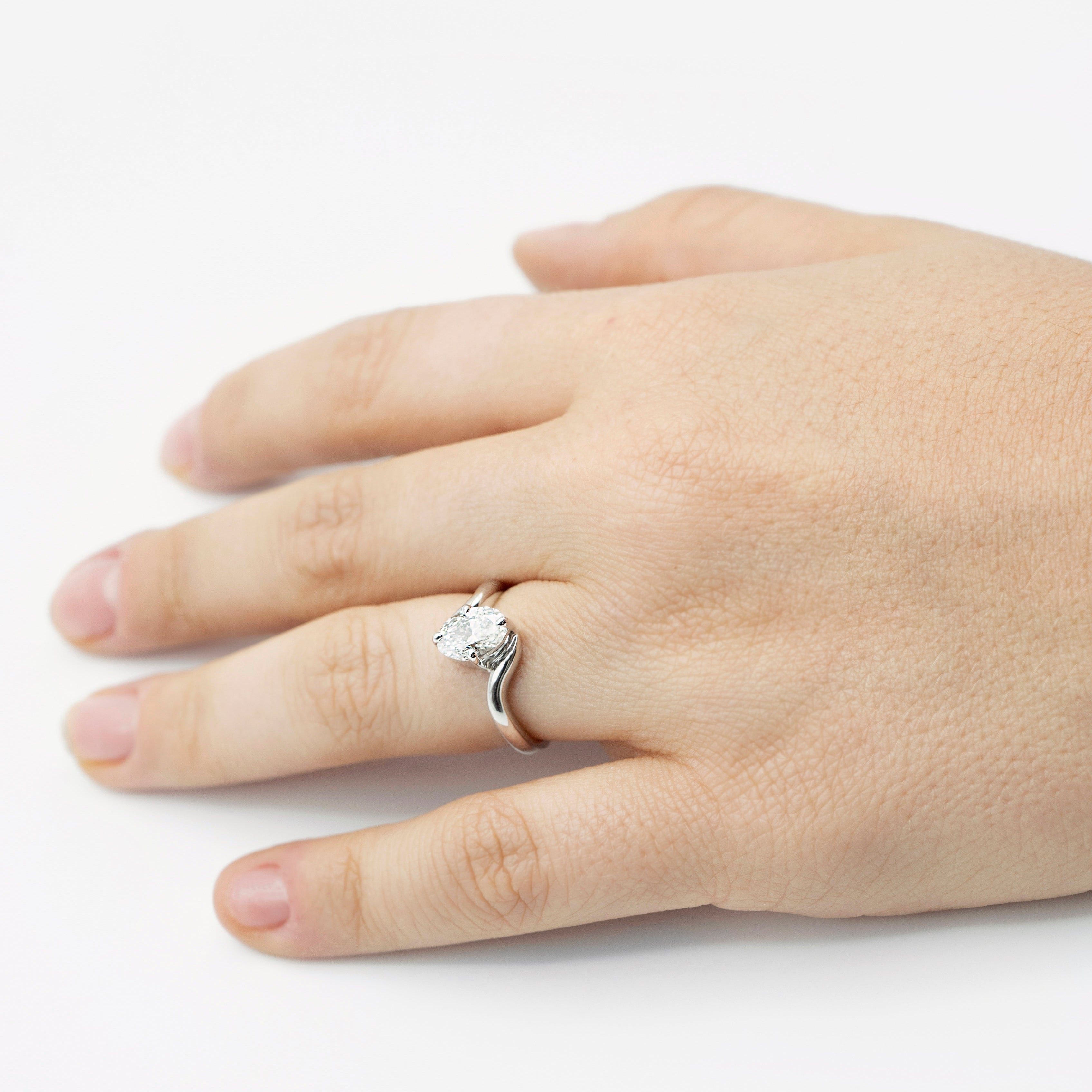 White gold oval cut diamond curved band engagement ring