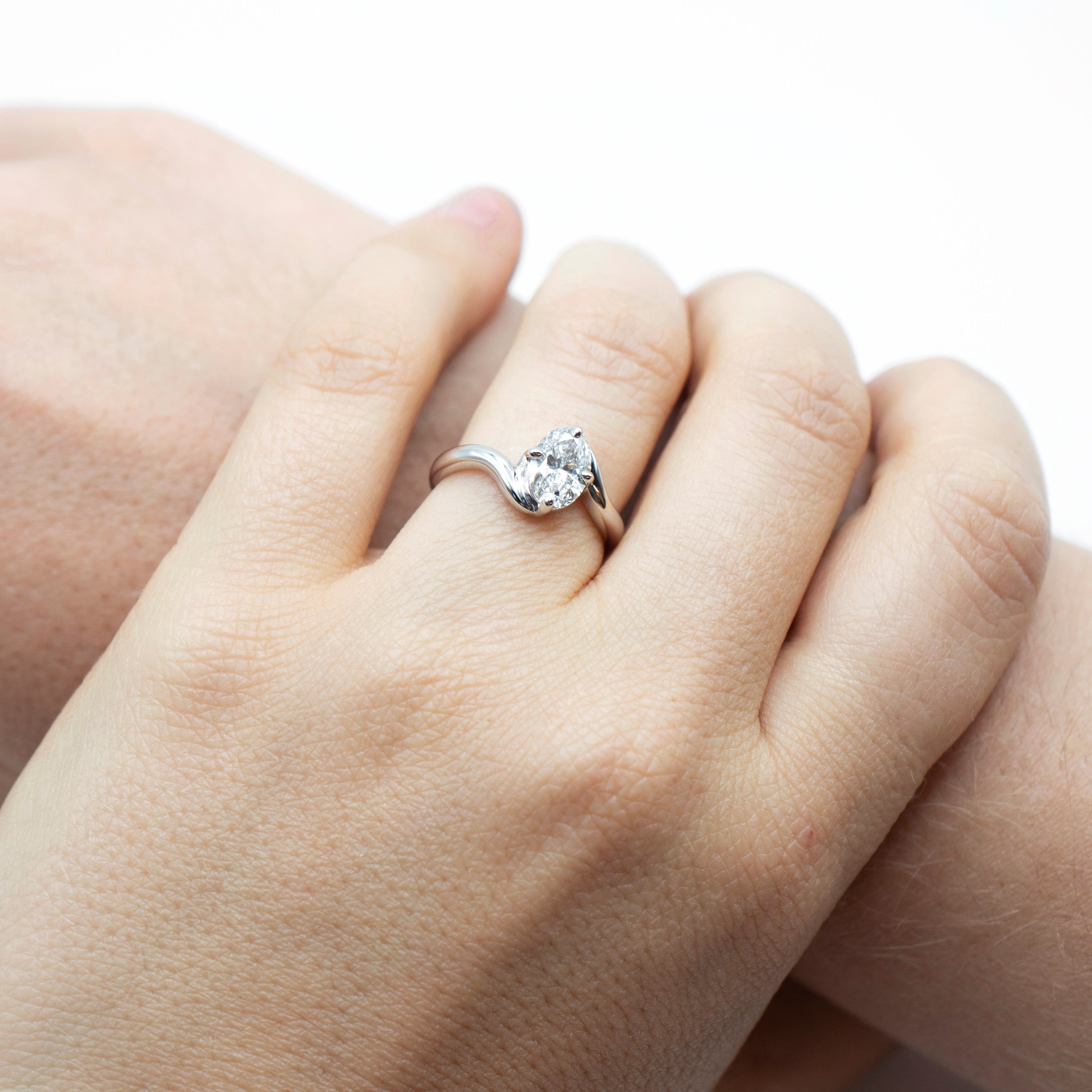 White gold oval cut diamond curved band engagement ring