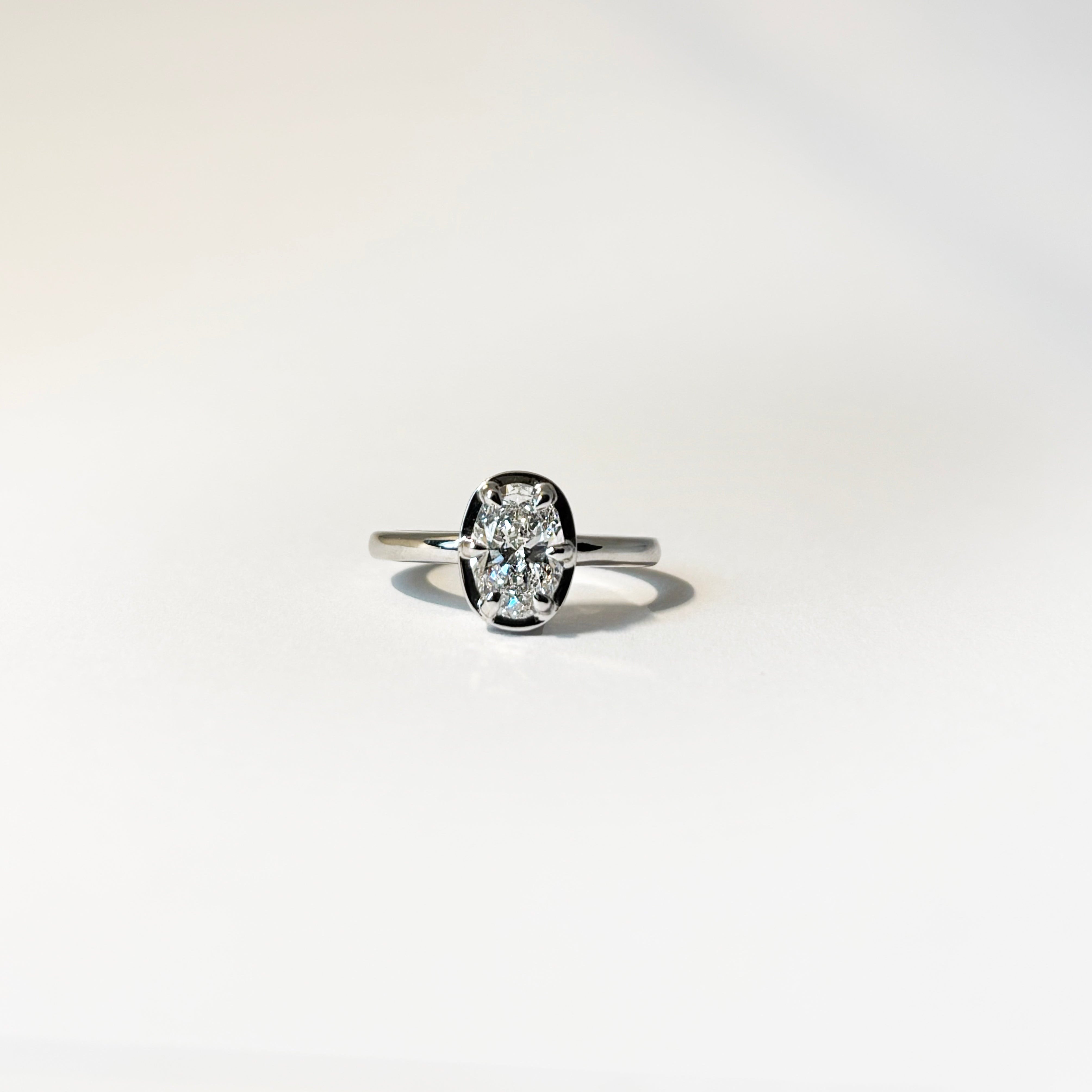14k white gold oval lab-grown diamond ring with six-prong half-bezel