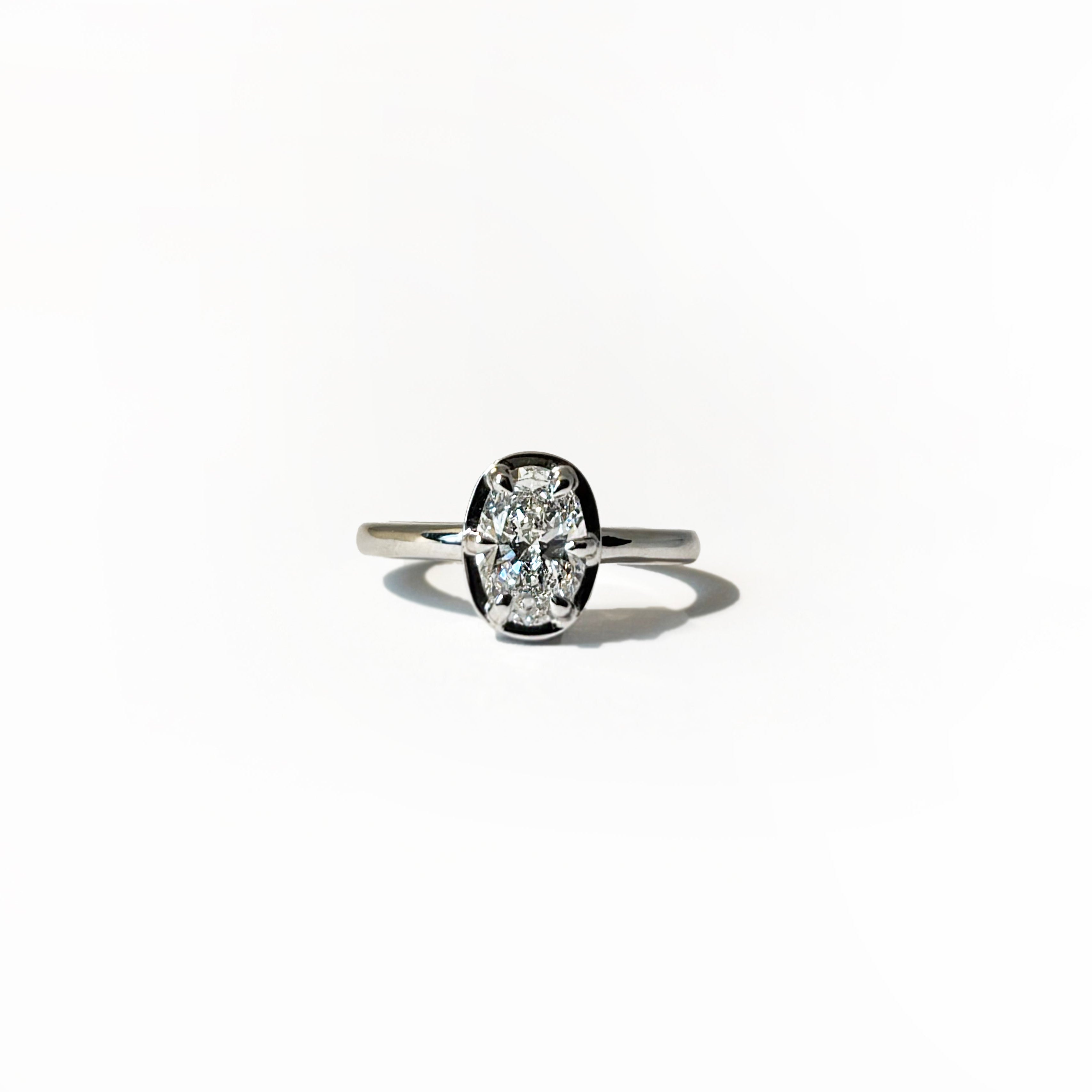 14k white gold oval lab-grown diamond ring with six-prong half-bezel