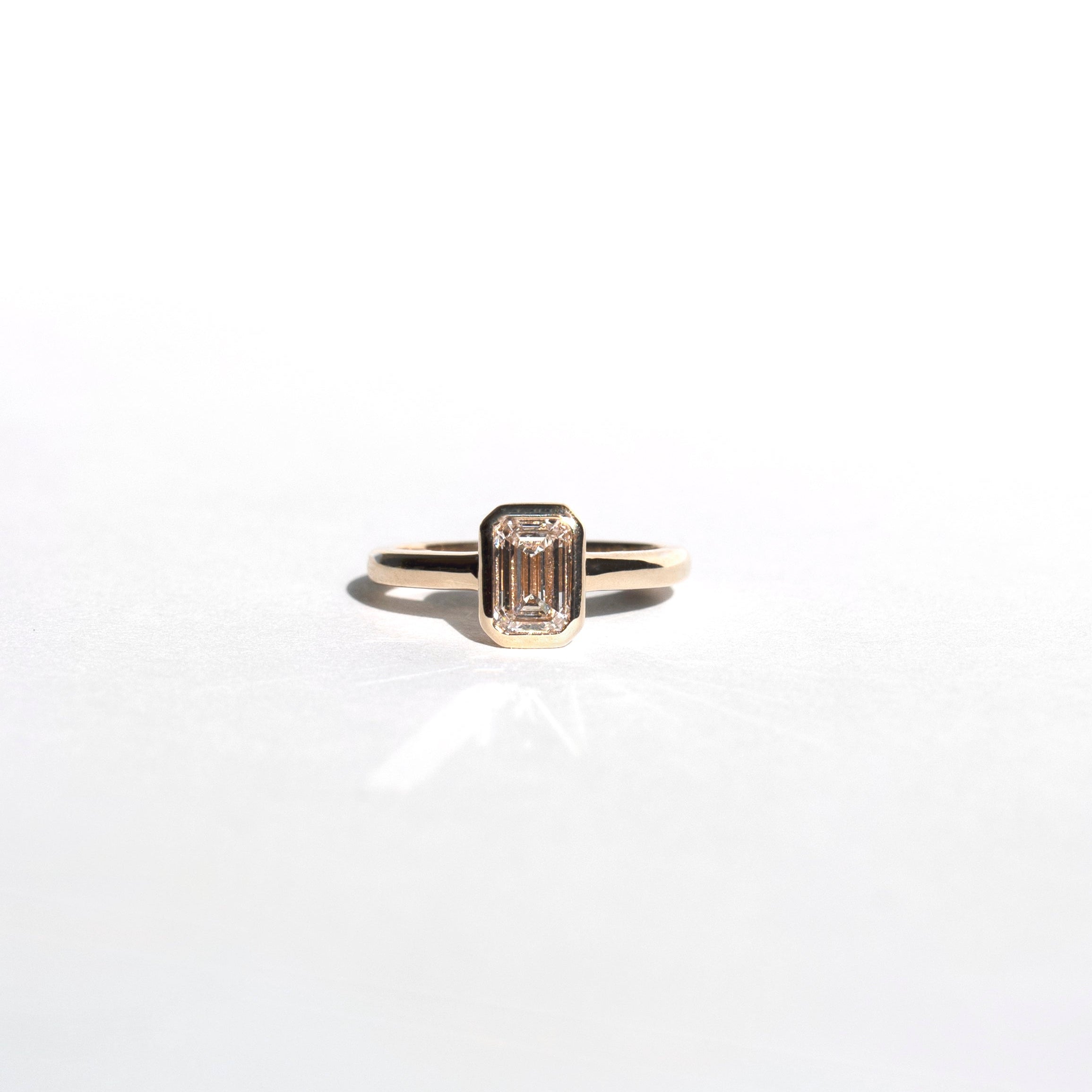 Emerald-cut lab-grown diamond engagement ring and diamond wedding band set