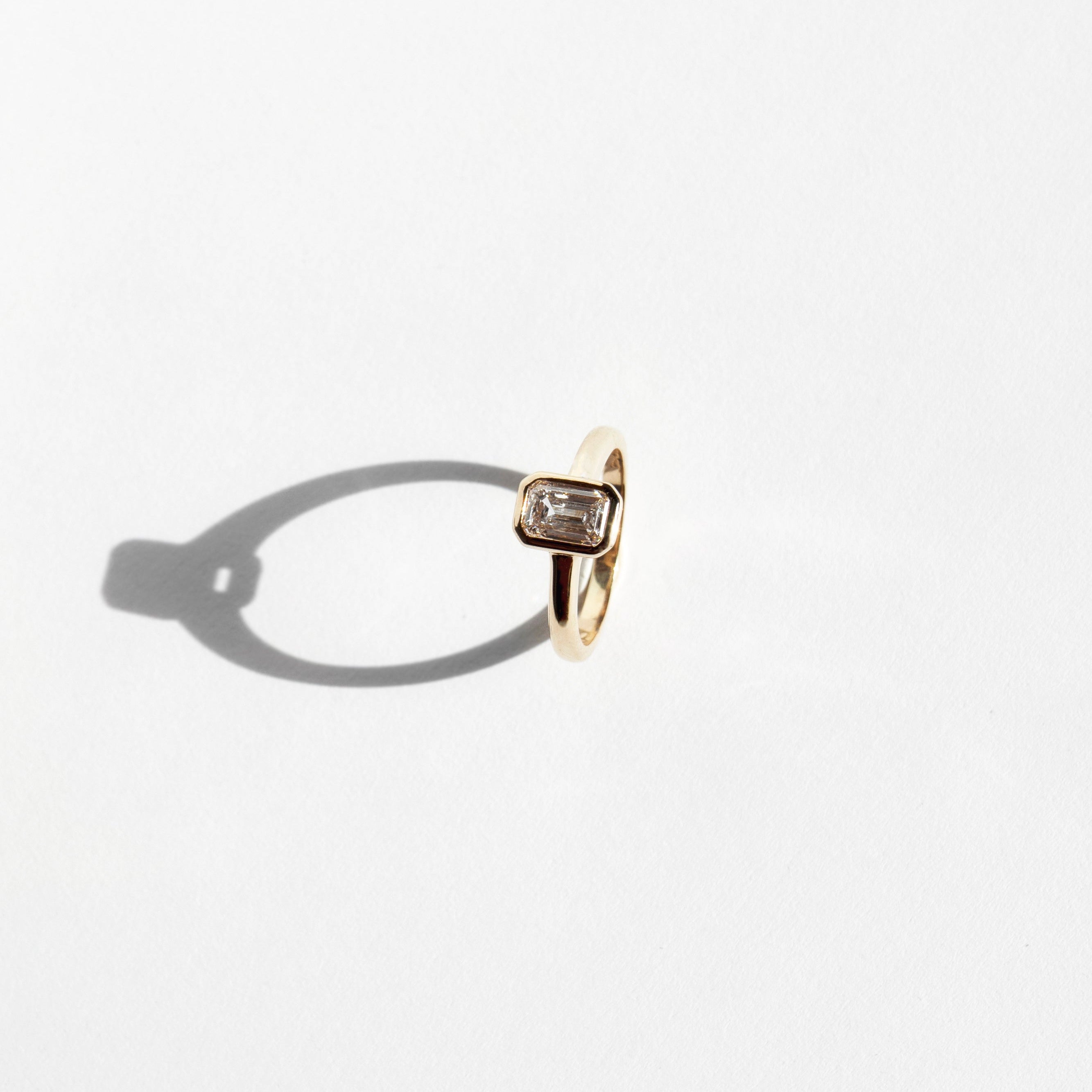 Emerald-cut lab-grown diamond engagement ring and diamond wedding band set