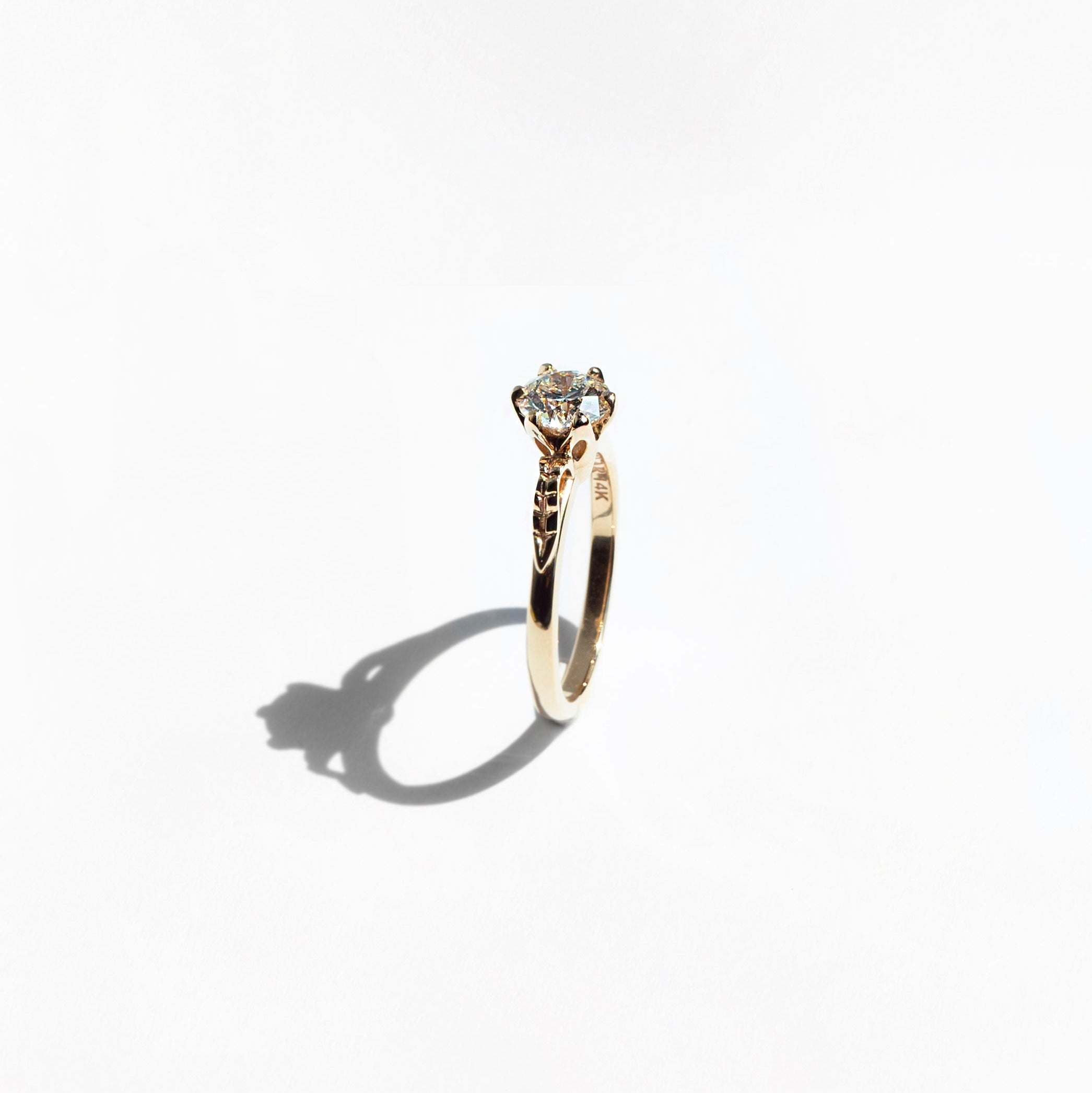 Floral six-prong round diamond ring in 14k yellow gold