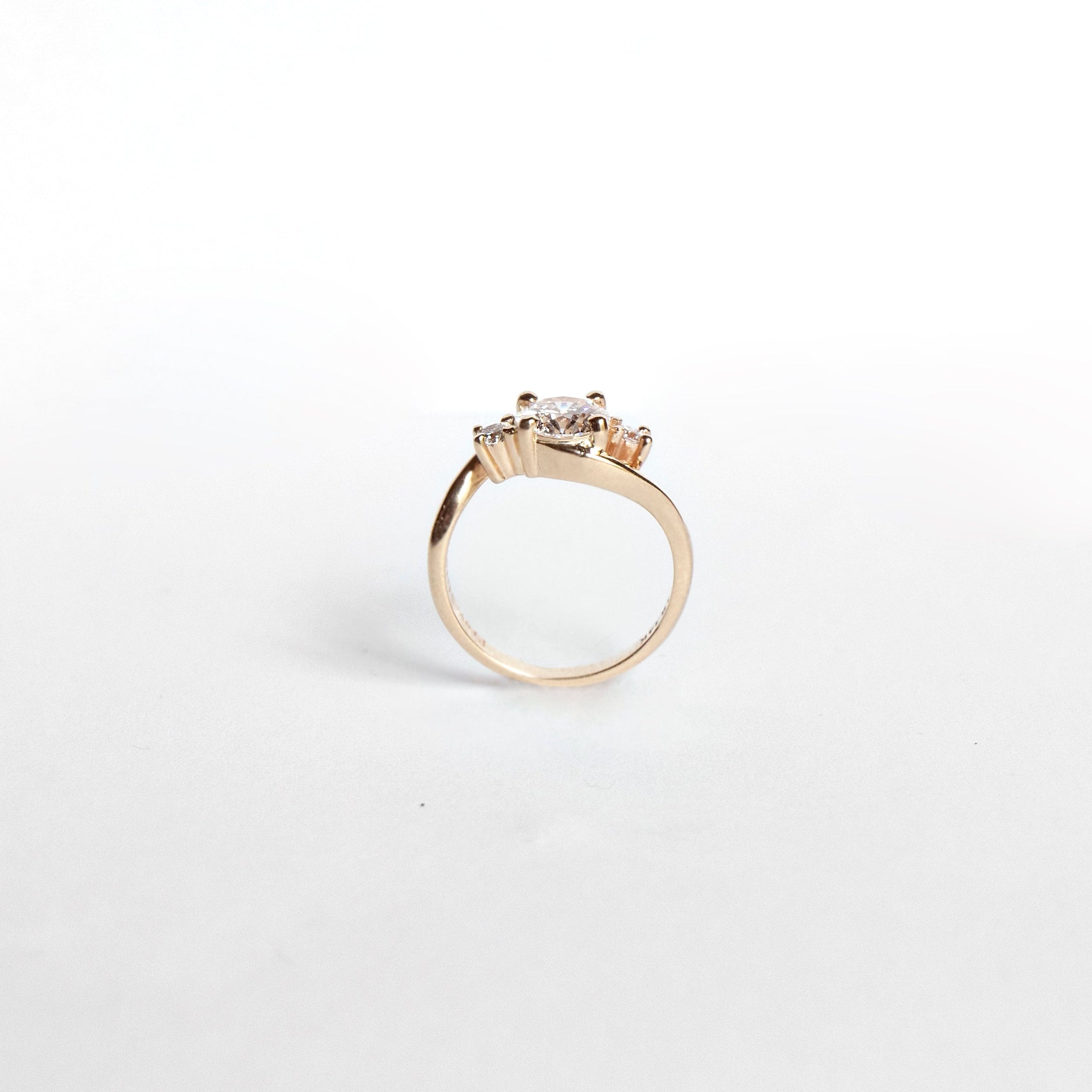 Asymmetrical curved diamond engagement ring in 14k yellow gold