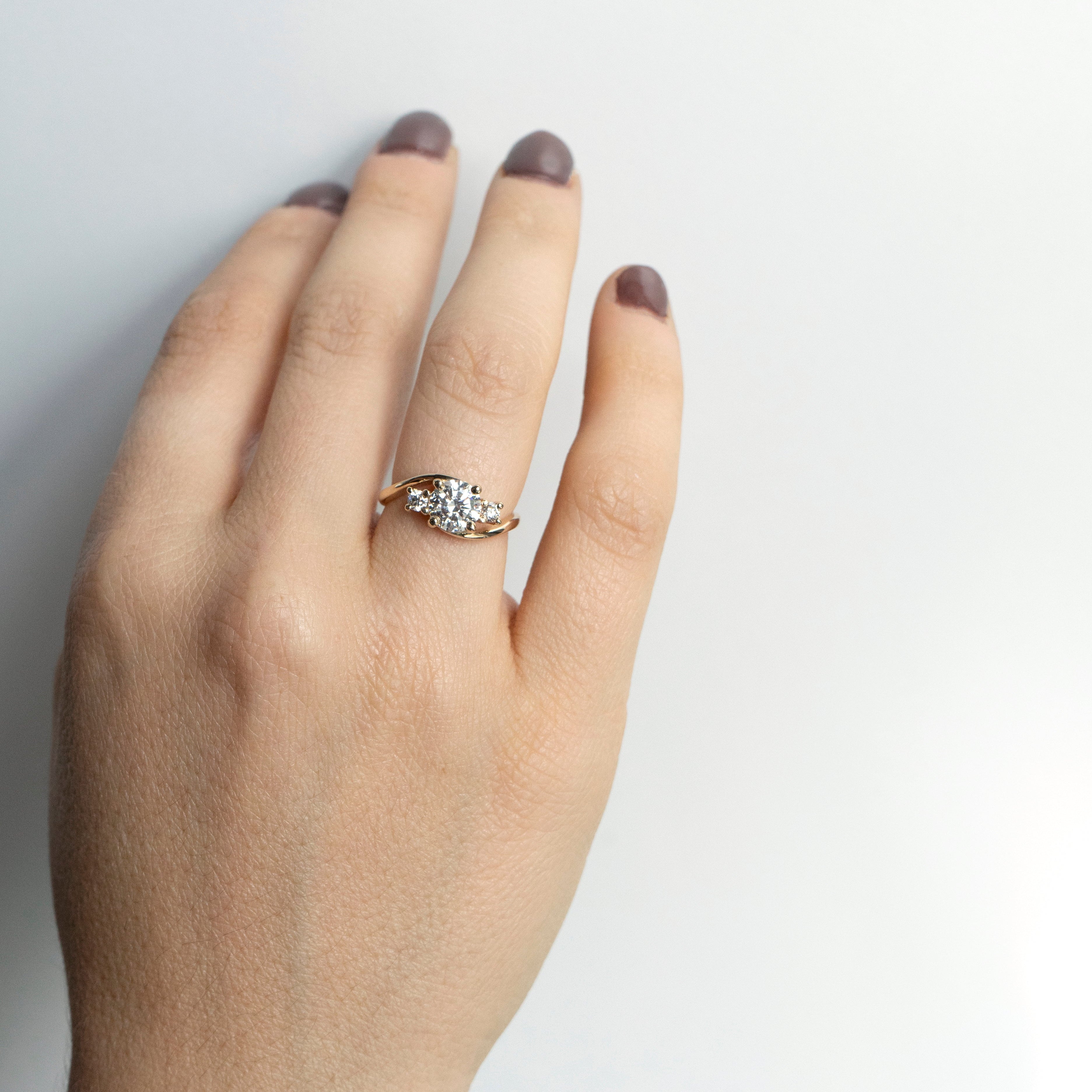 Asymmetrical curved diamond engagement ring in 14k yellow gold