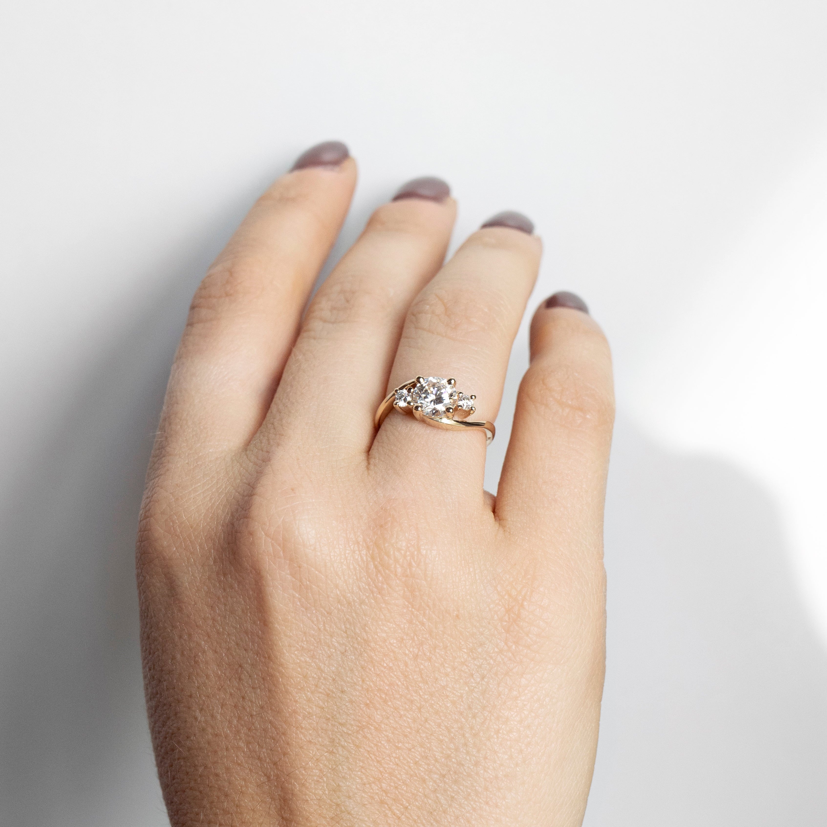 Asymmetrical curved diamond engagement ring in 14k yellow gold