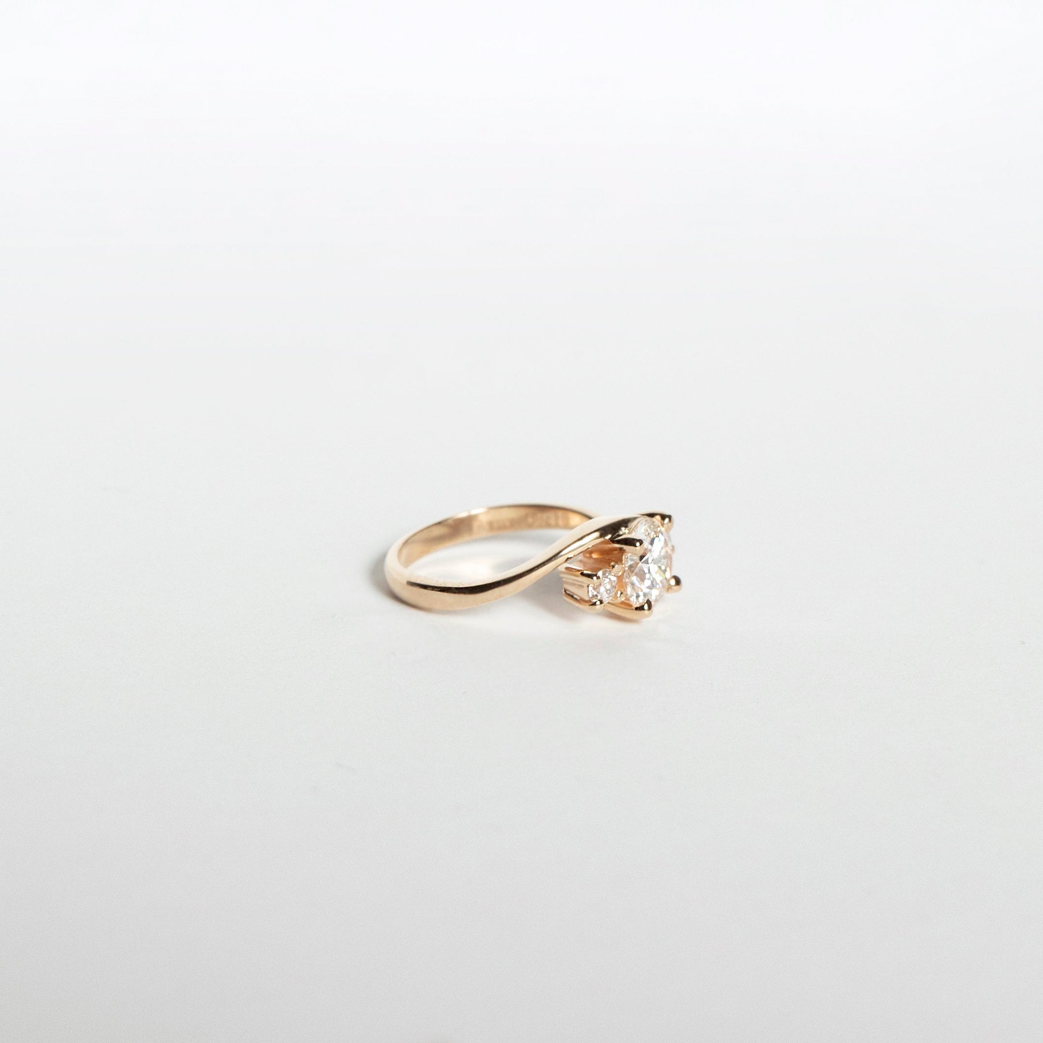Asymmetrical curved diamond engagement ring in 14k yellow gold