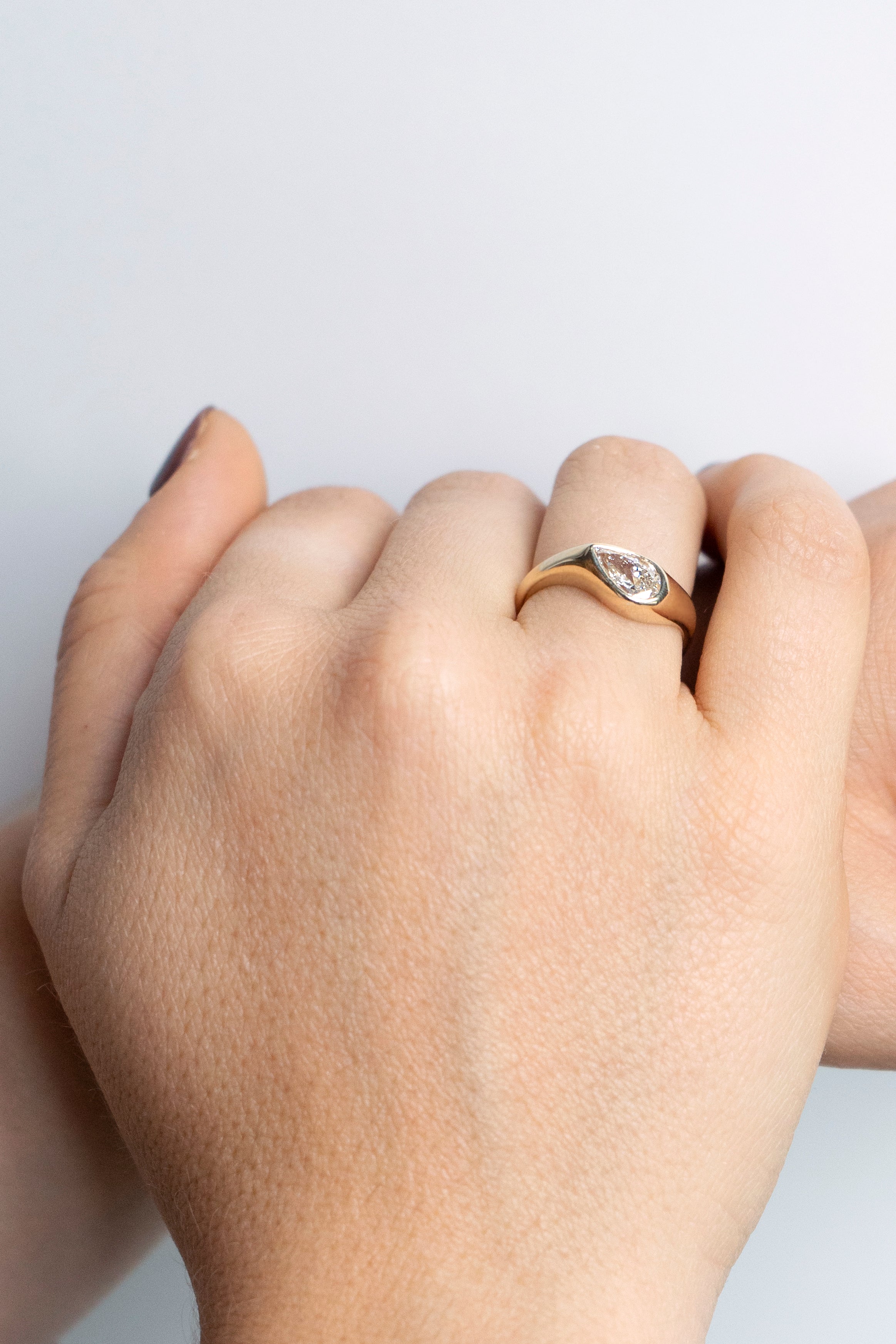 Pear-cut diamond engagement ring with curved chunky band