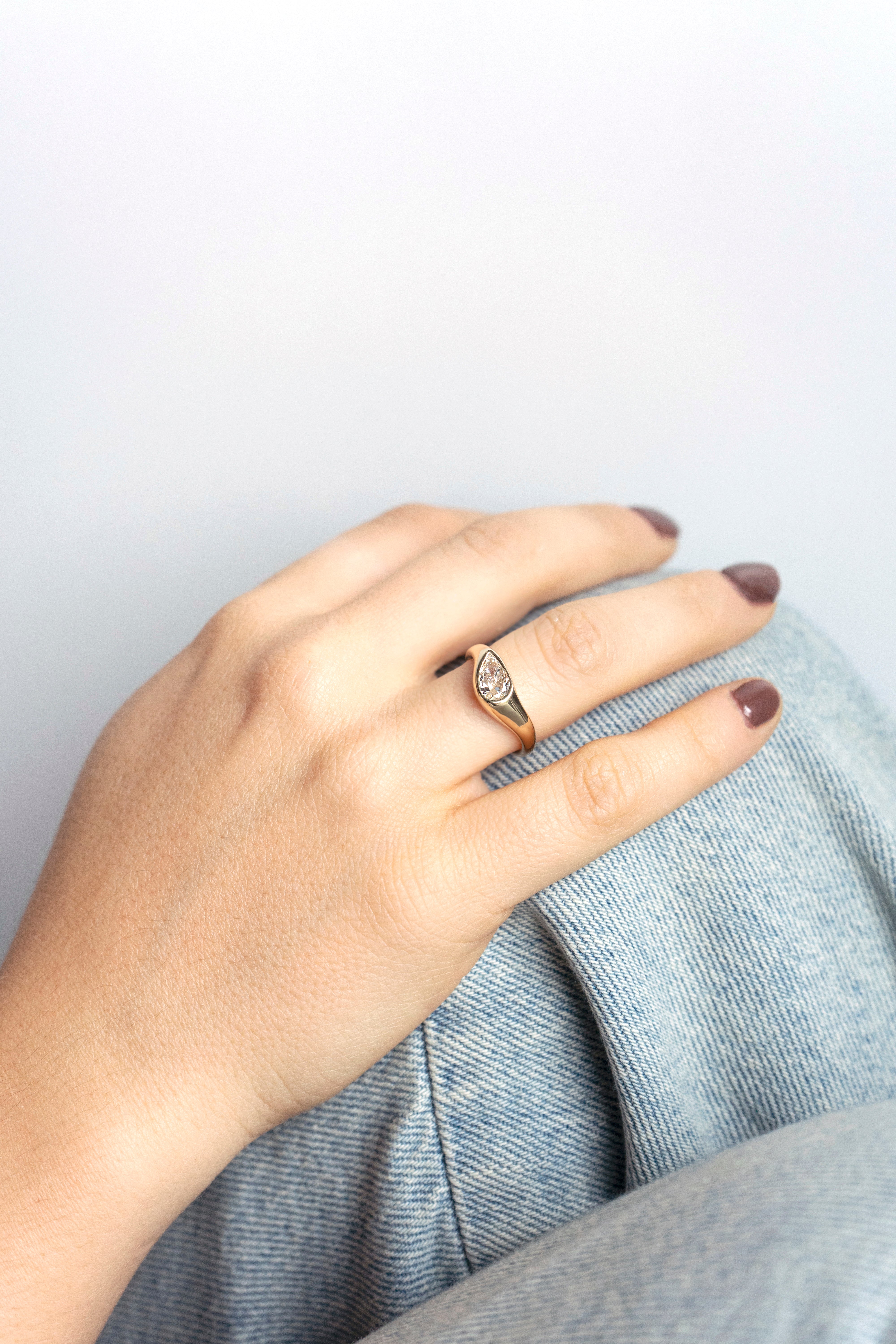 Pear-cut diamond engagement ring with curved chunky band