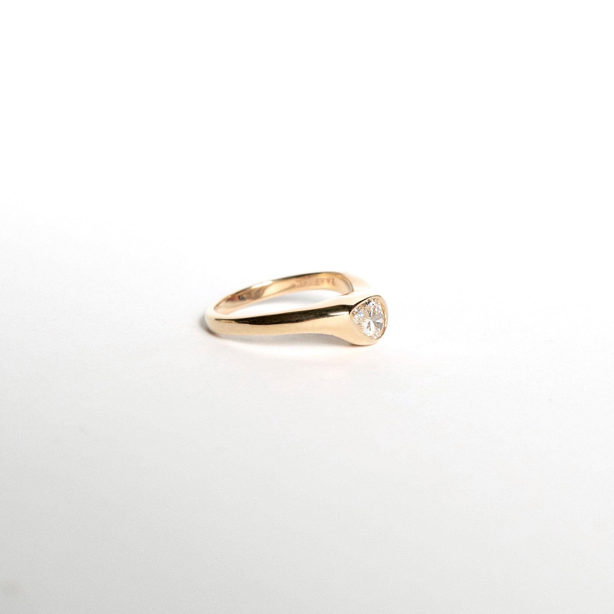 Pear-cut diamond engagement ring with curved chunky band