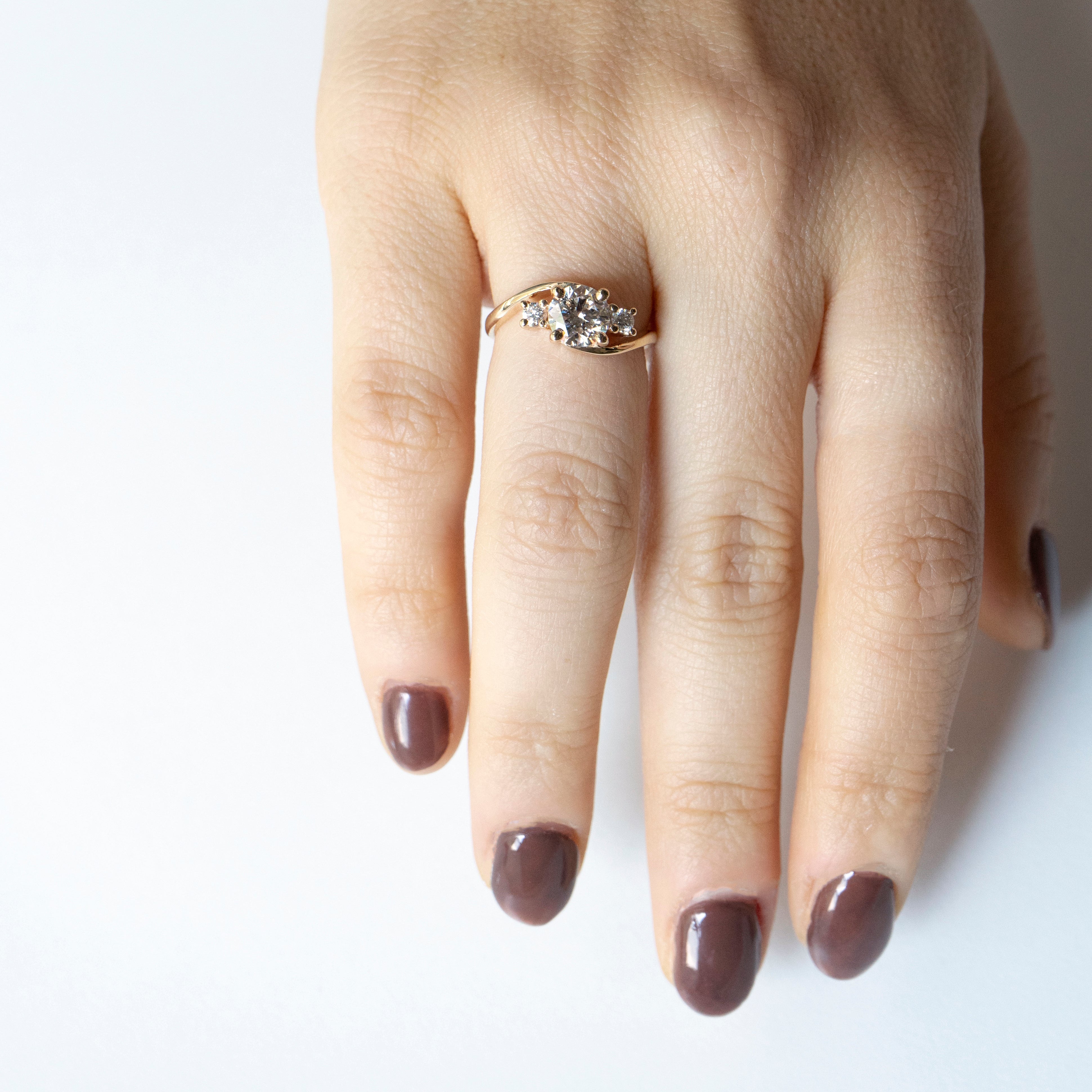 Asymmetrical curved diamond engagement ring in 14k yellow gold