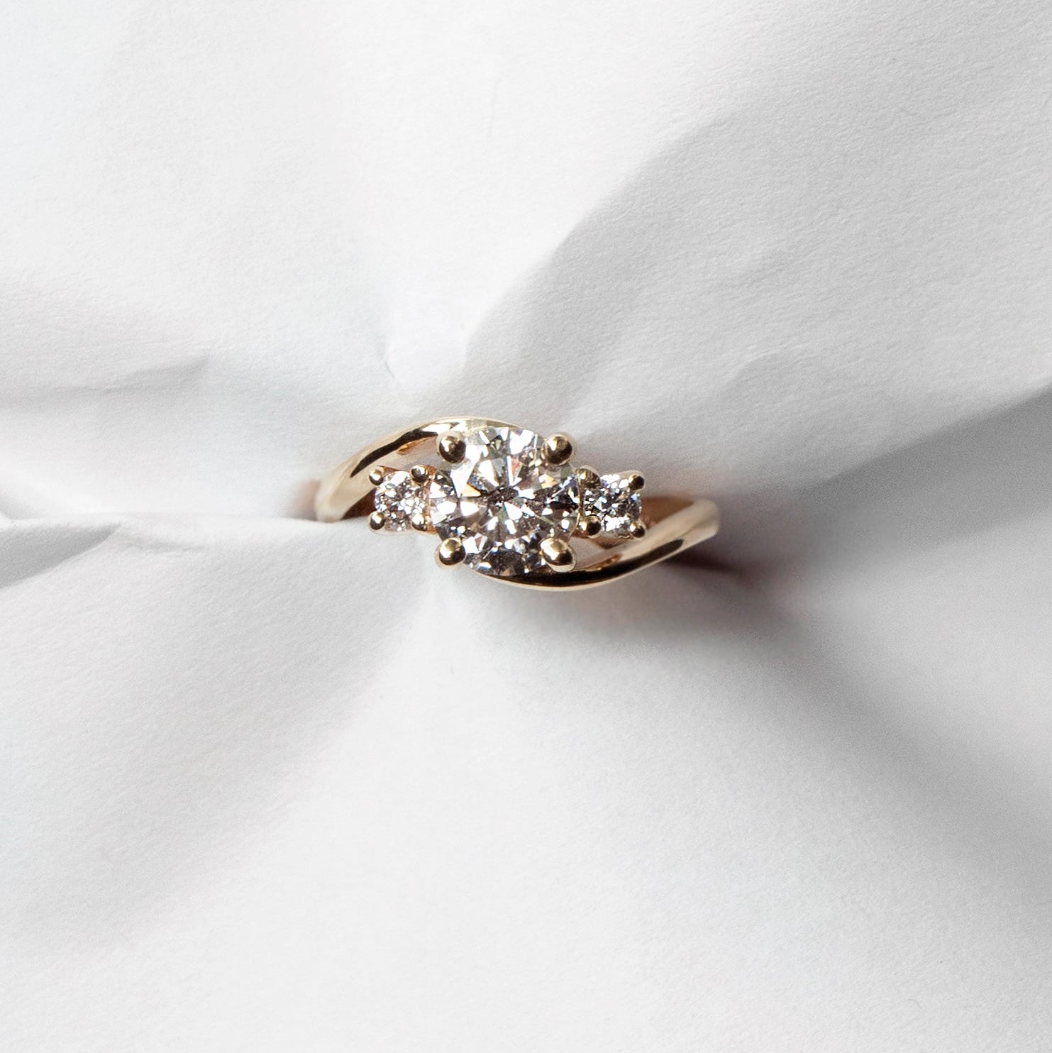 Asymmetrical curved diamond engagement ring in 14k yellow gold