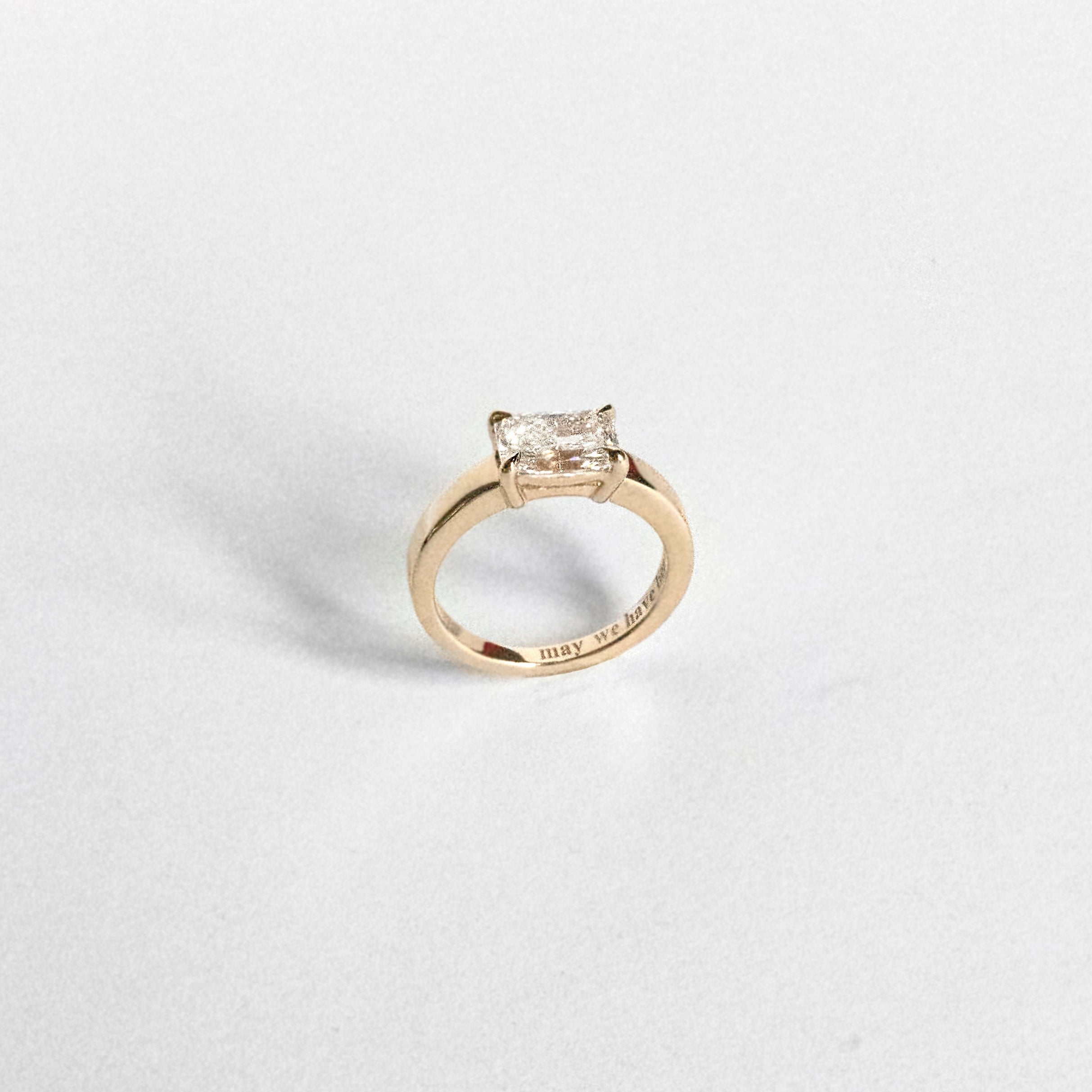 Radiant-cut lab-grown diamond engagement ring set east-west
