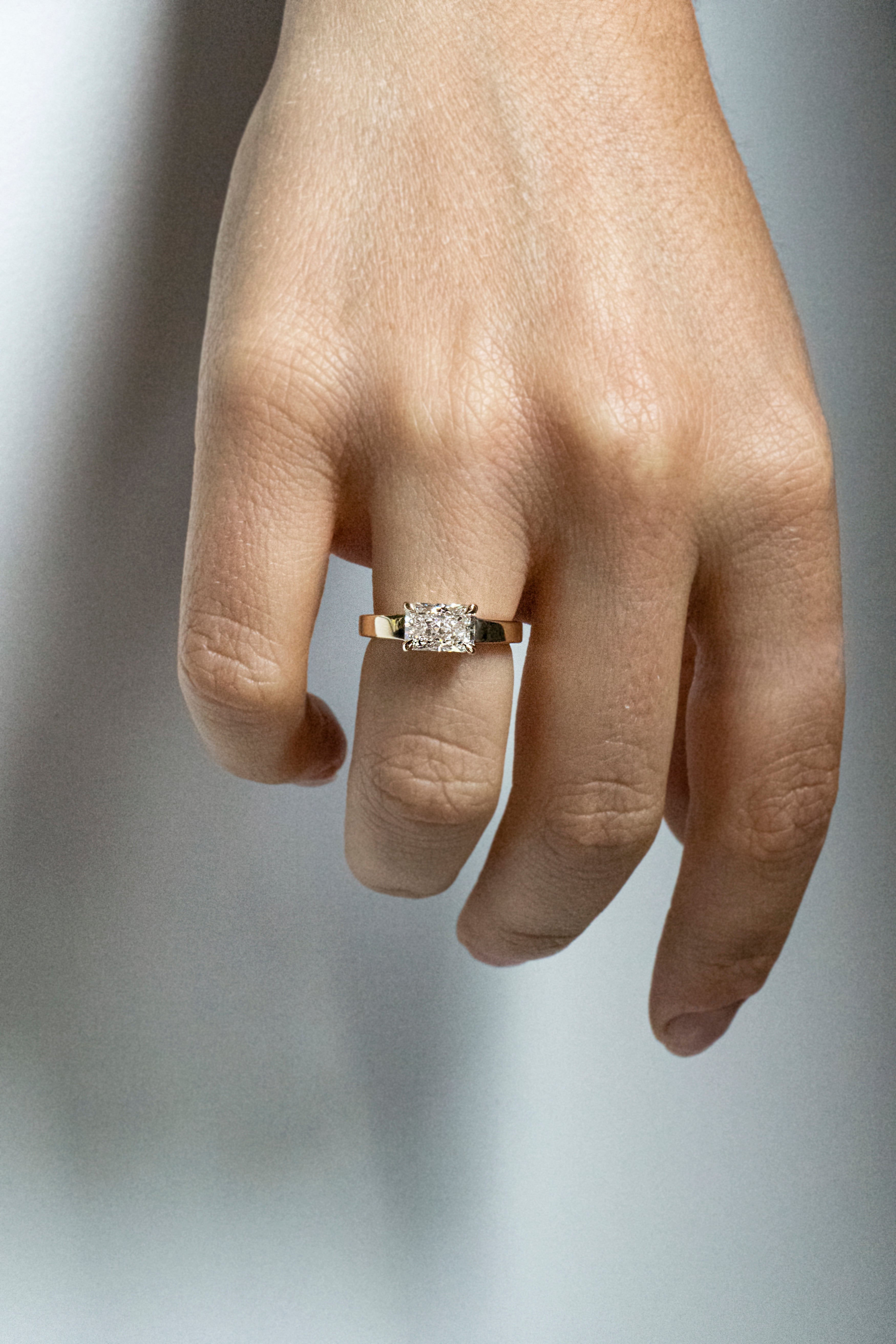 Radiant-cut lab-grown diamond engagement ring set east-west