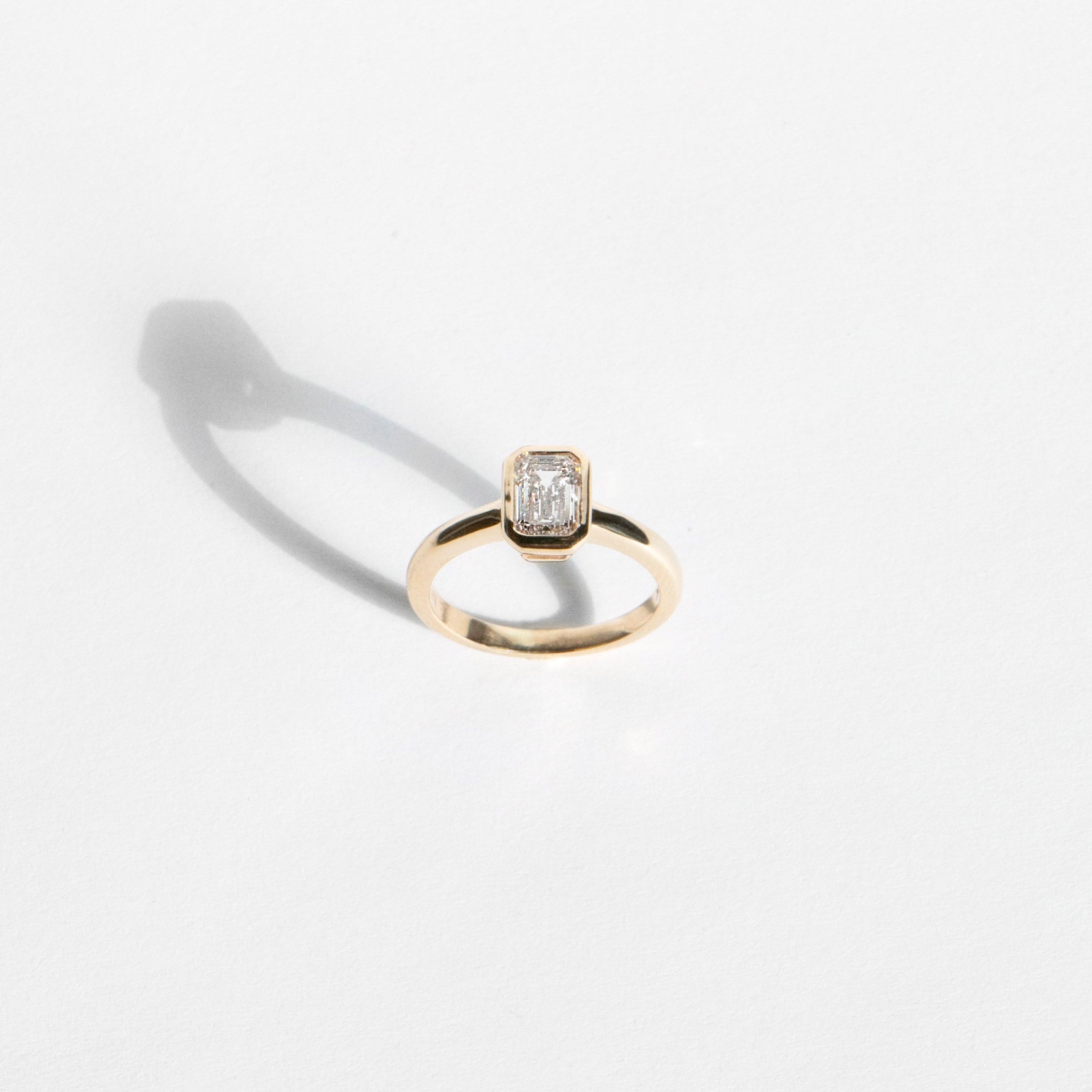 Emerald-cut lab-grown diamond engagement ring and diamond wedding band set