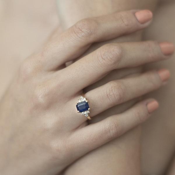 Emerald-cut sapphire and diamond engagement ring
