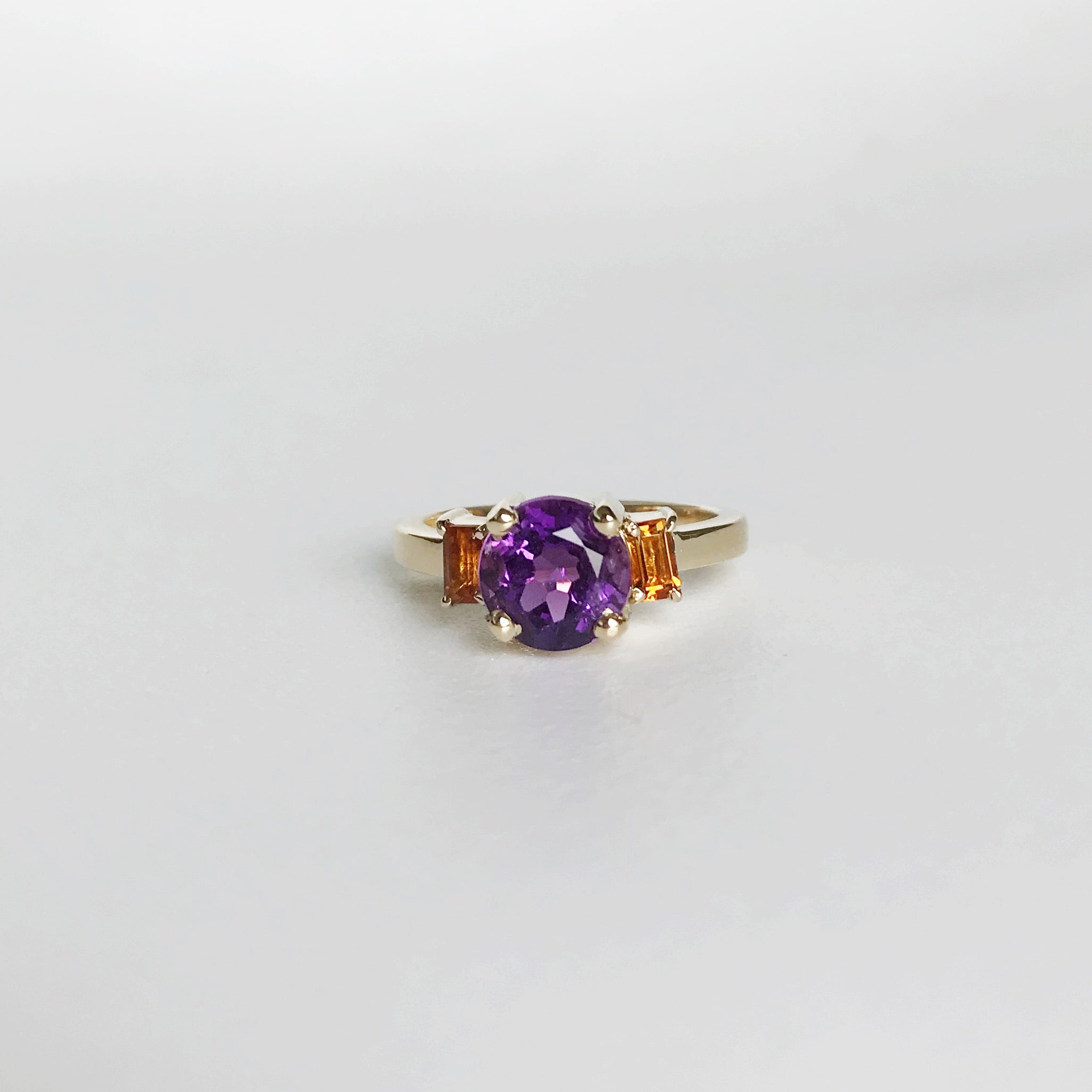 Round amethyst and baguette-cut citrines engagement ring