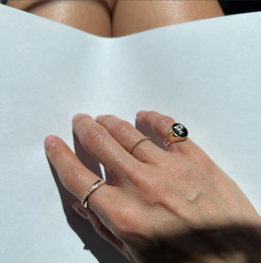 Yellow gold, onyx and diamond letter signet ring